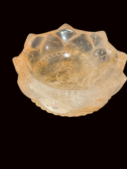 Golden Healer Quartz Lotus Bowl held in hand showing interior view with golden inclusions