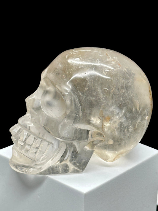 Clear Quartz Crystal Skull with Hematite Inclusion.