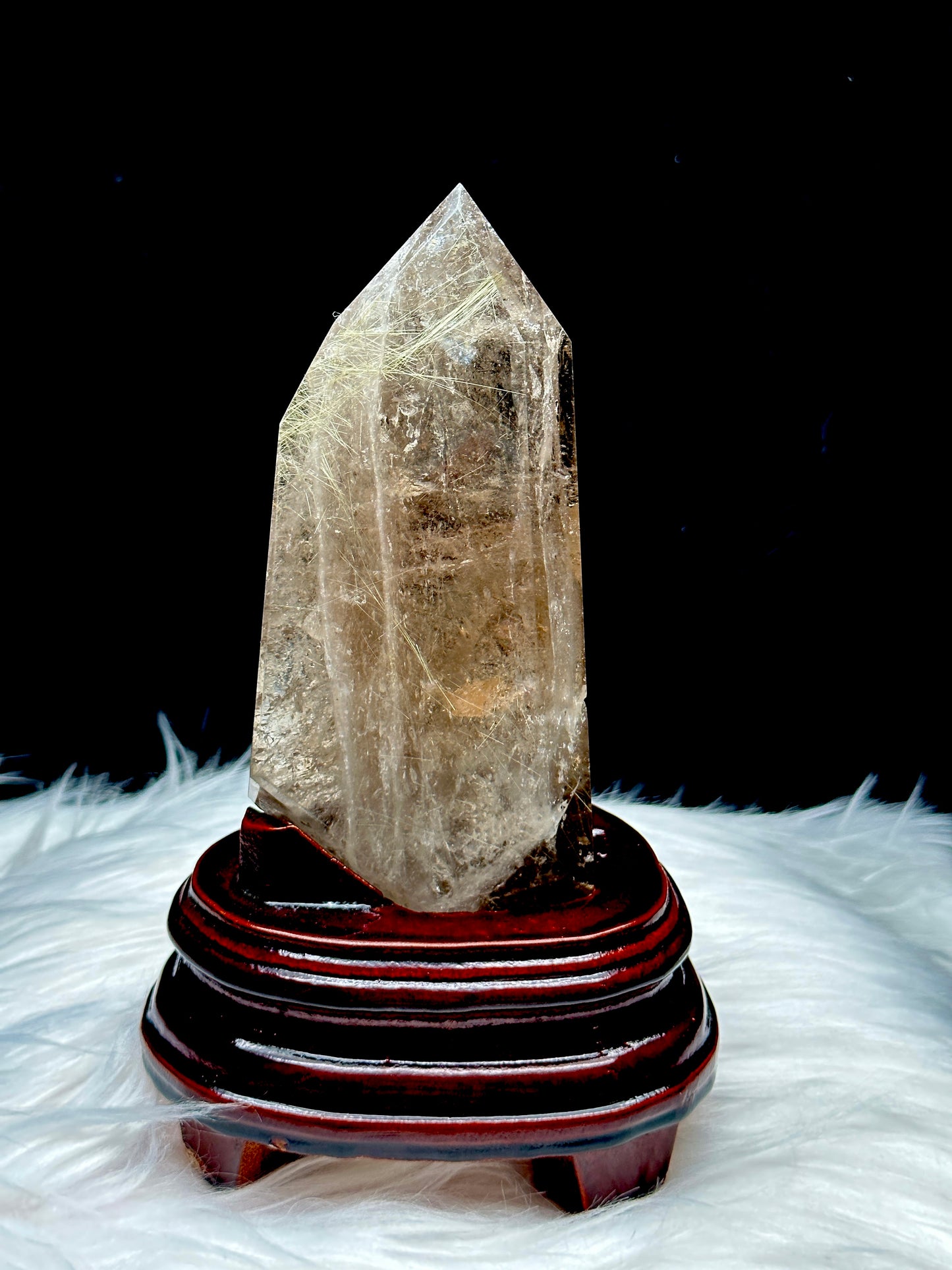 Smoky Quartz tower with silver rutile inclusions on wooden stand