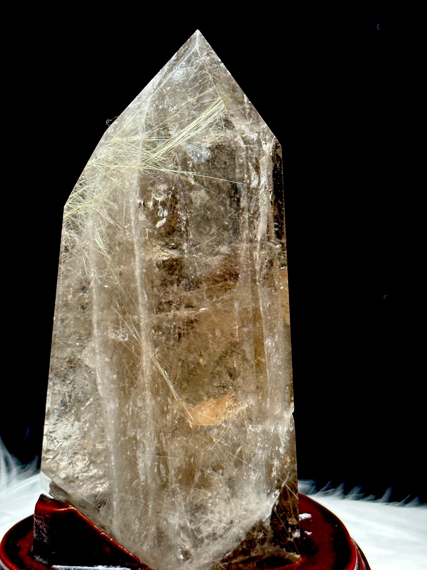 Smoky Quartz tower with silver rutile inclusions on wooden stand