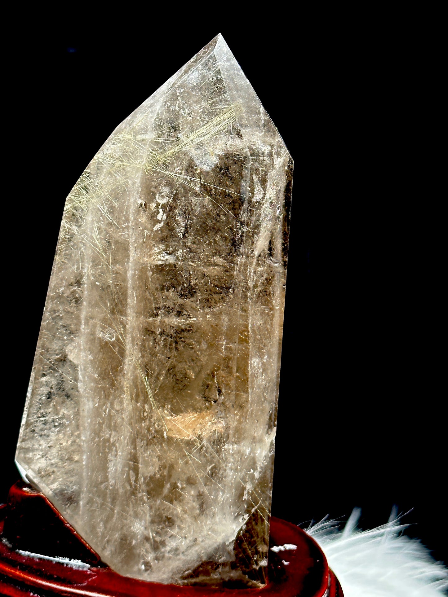 Smoky Quartz tower with silver rutile inclusions on wooden stand