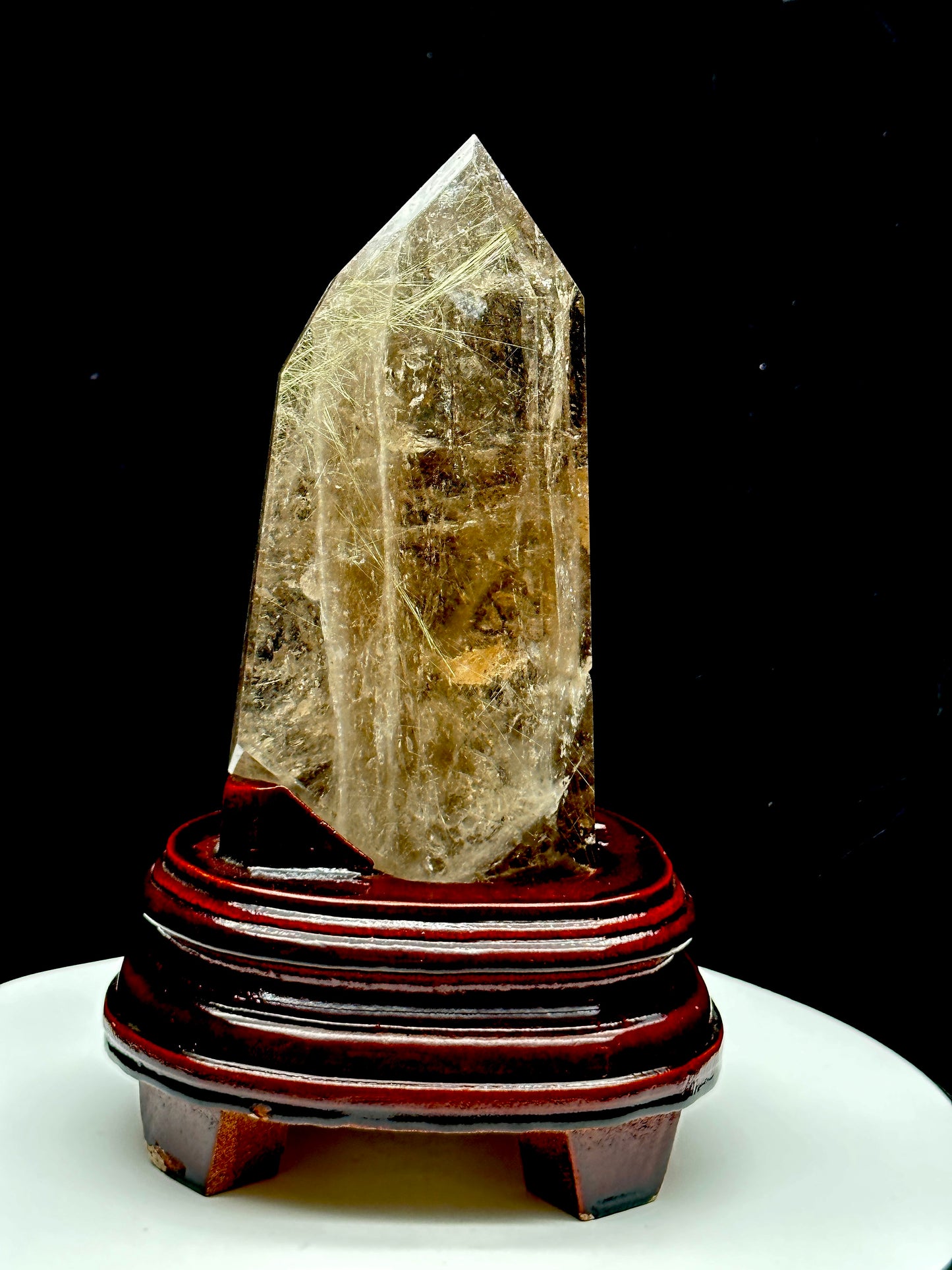 Smoky Quartz tower with silver rutile inclusions on wooden stand