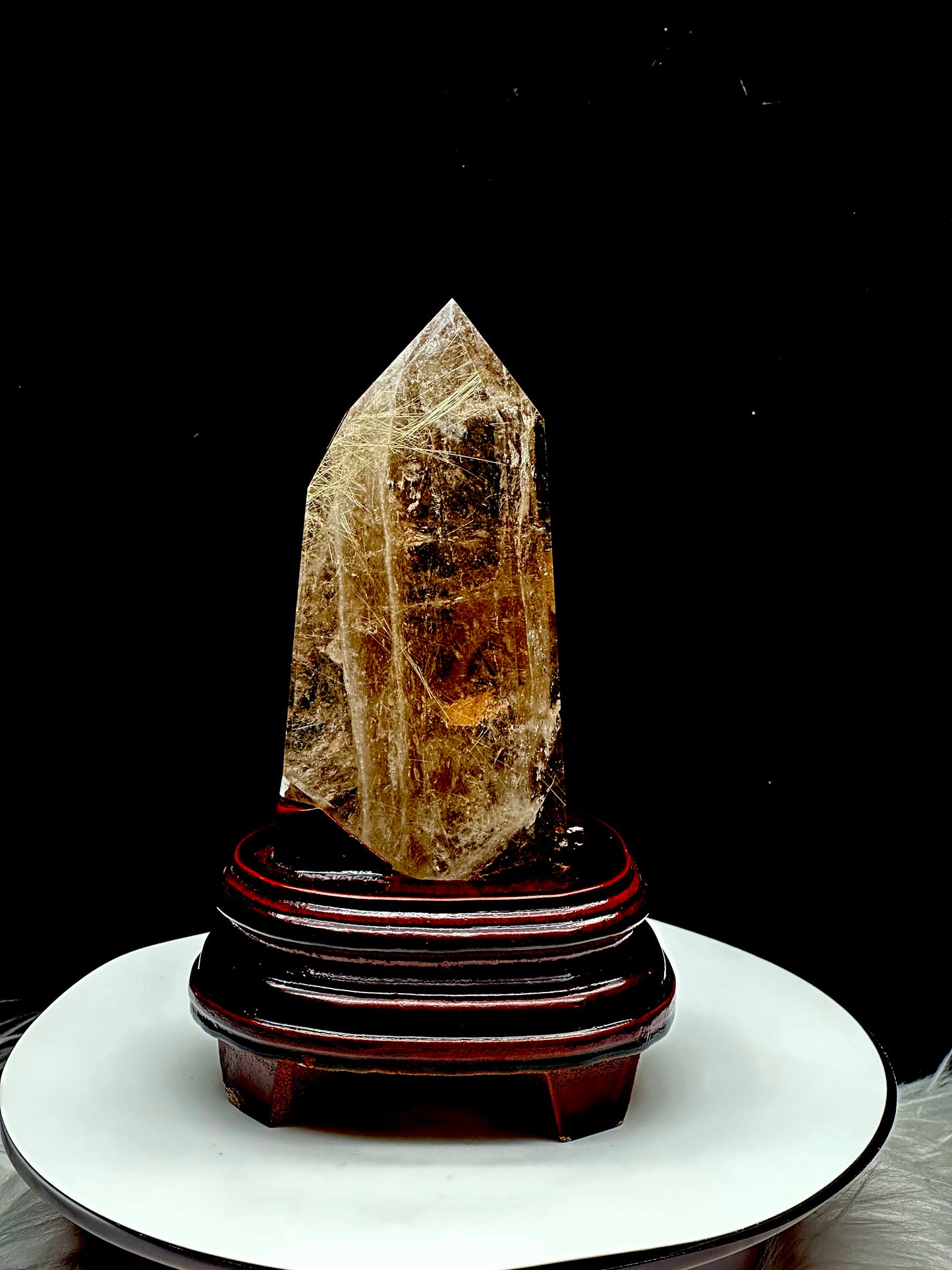 Smoky Quartz tower with silver rutile inclusions on wooden stand