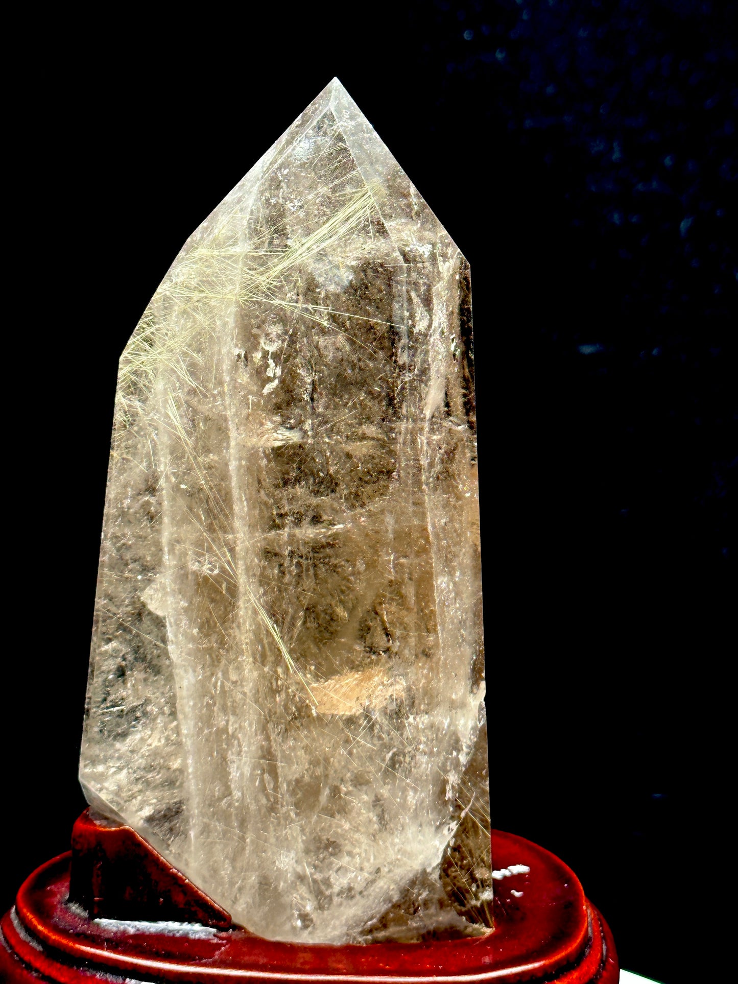 Smoky Quartz tower with silver rutile inclusions on wooden stand