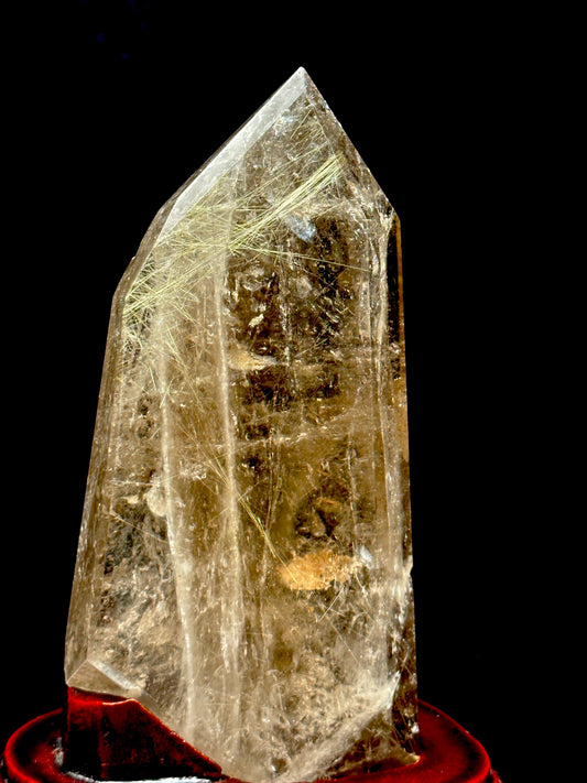 Smoky Quartz tower with silver rutile inclusions on wooden stand