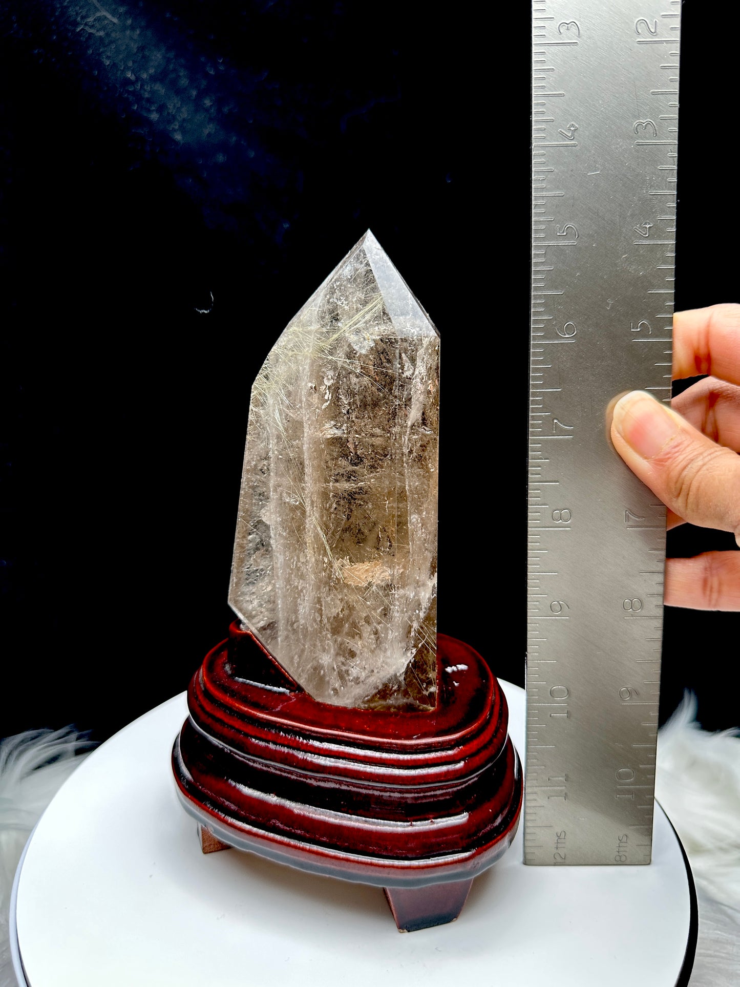 Smoky Quartz tower with silver rutile inclusions on wooden stand