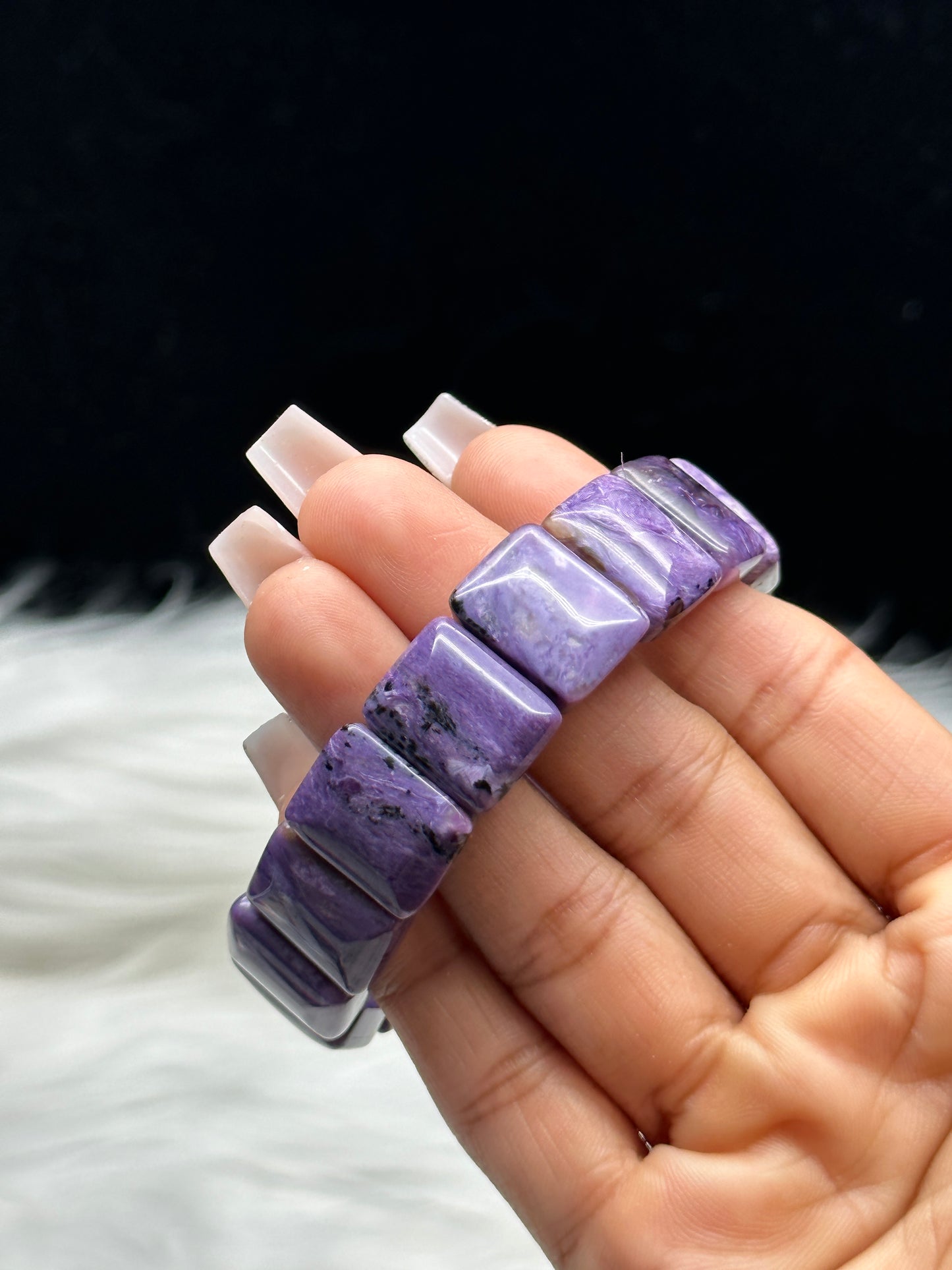 Natural charoite crystal bangle bracelet - worn on wrist, top view