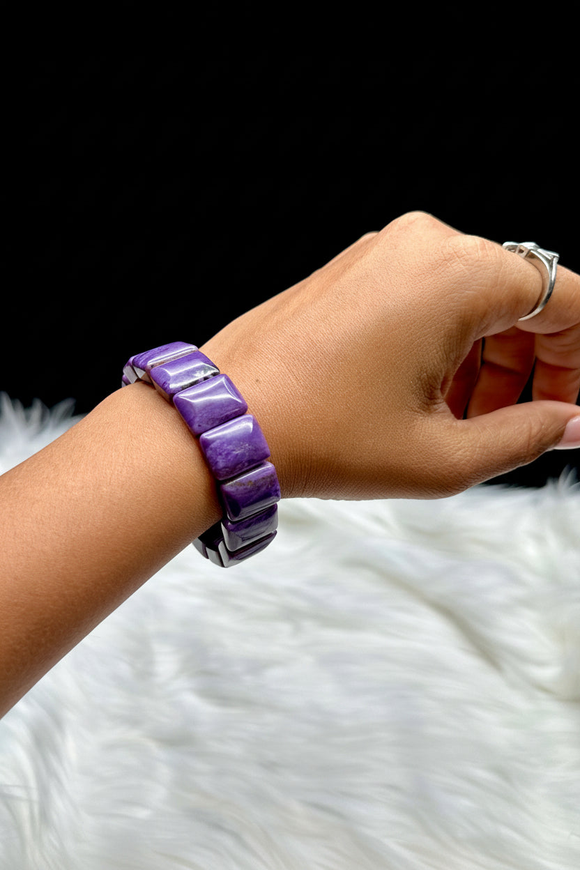 Natural charoite crystal bangle bracelet - worn on wrist, side profile view