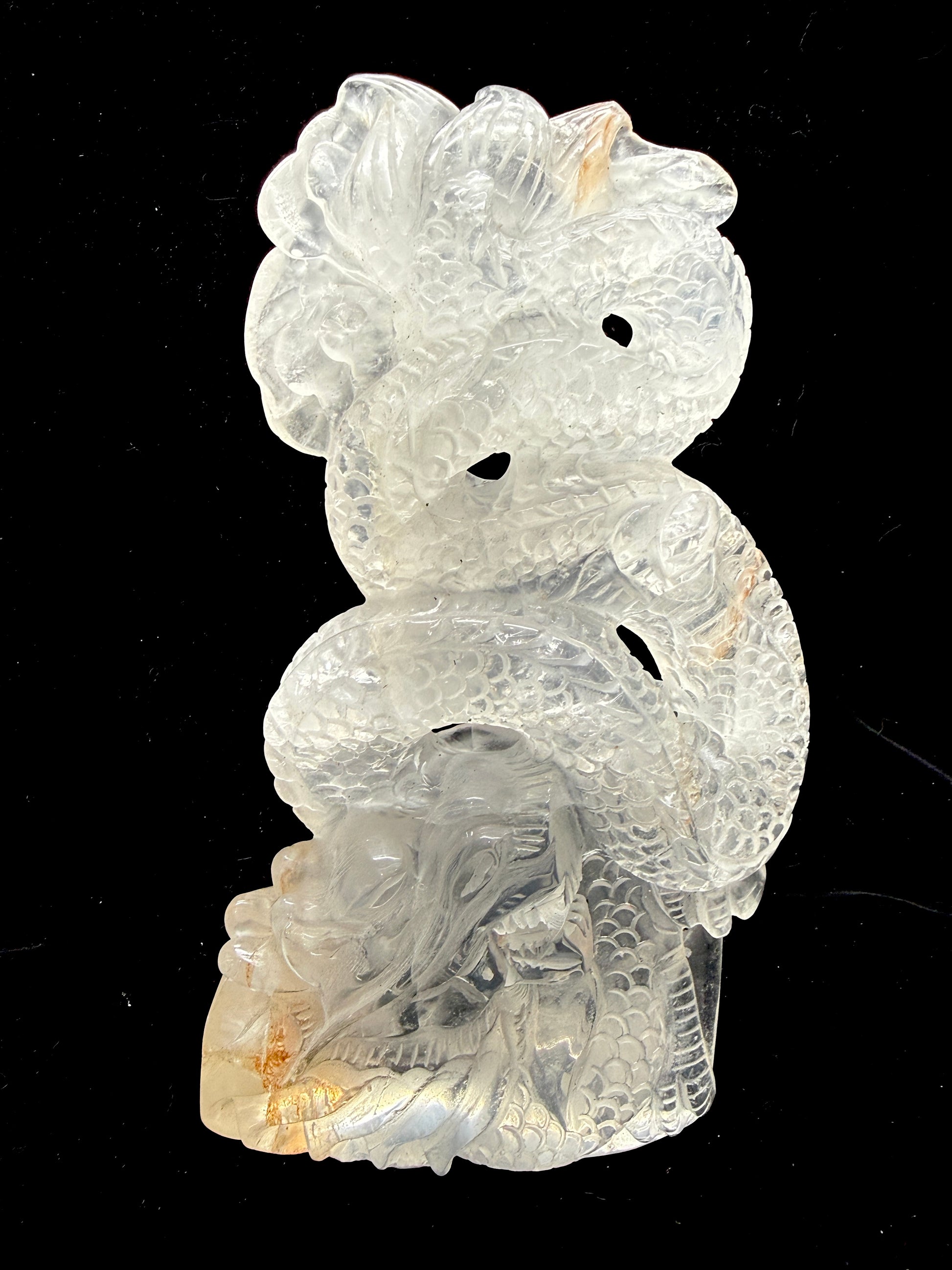 Clear quartz dragon carving - angle view