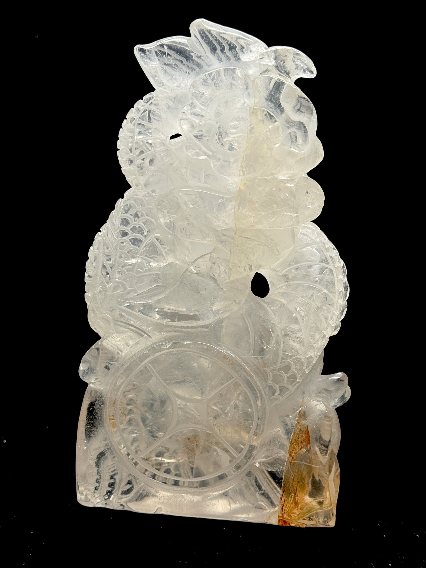 Clear quartz dragon carving with coin - back view