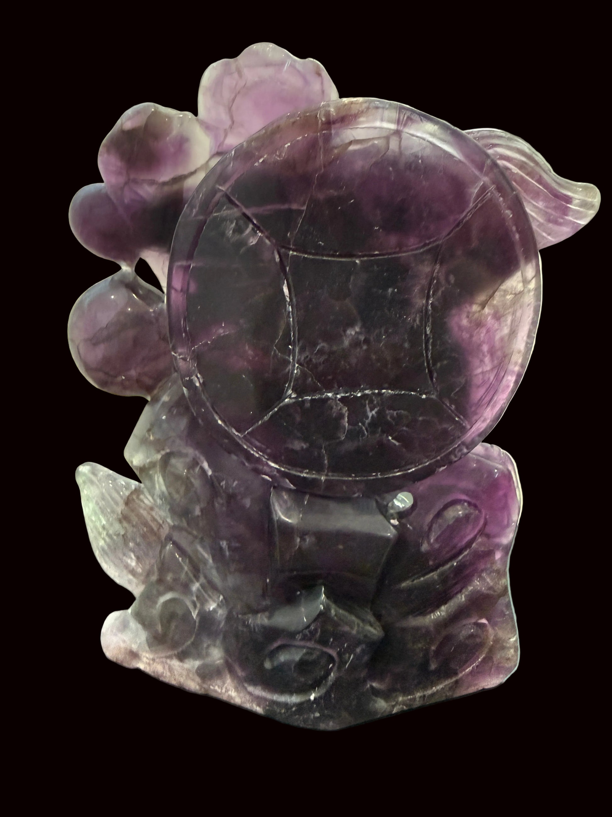 Purple fluorite dragon carving - coin detail view