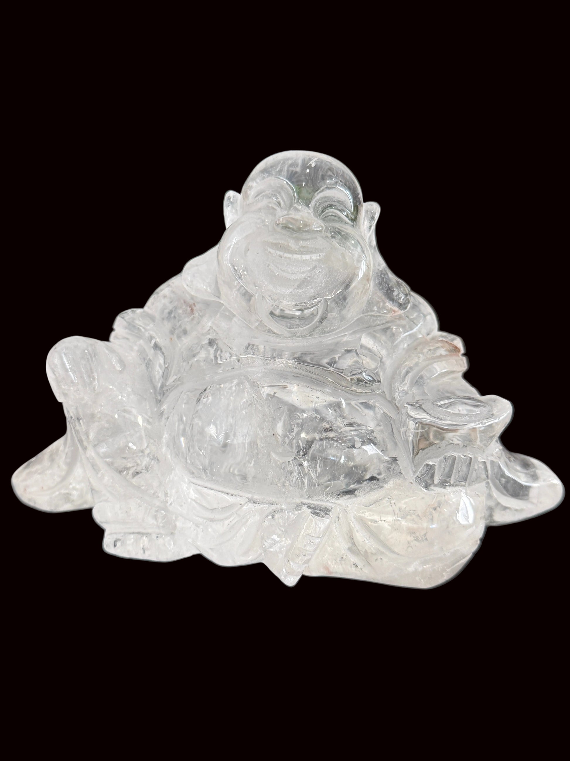 Clear quartz laughing Buddha carving - front view showing glass-like clarity