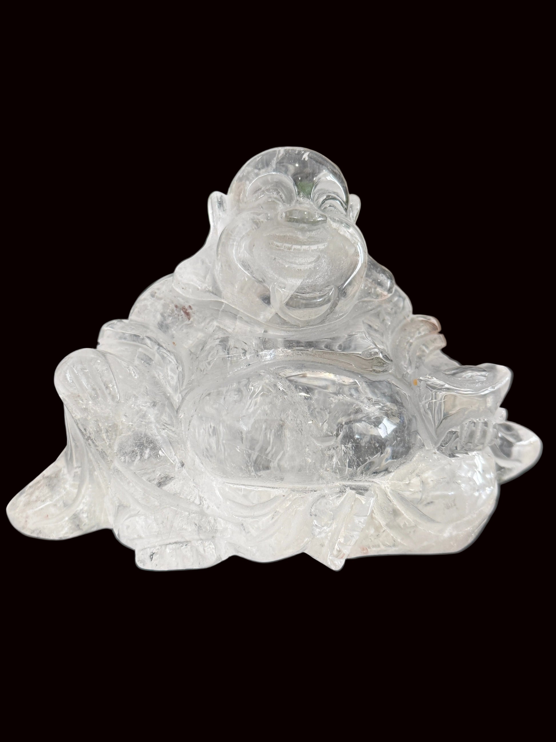 Clear quartz laughing Buddha carving - side view 1