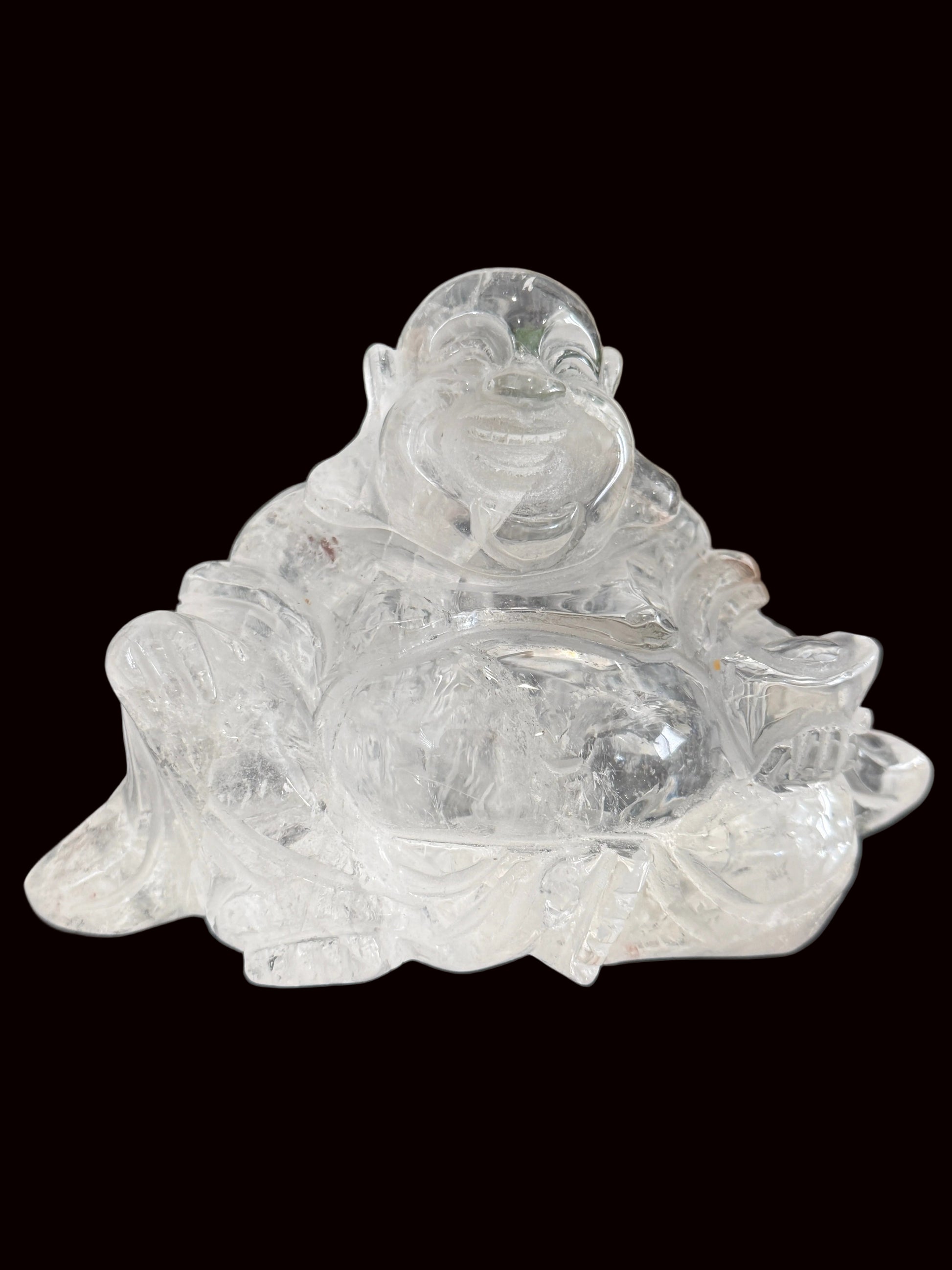 Clear quartz laughing Buddha carving - side view 2