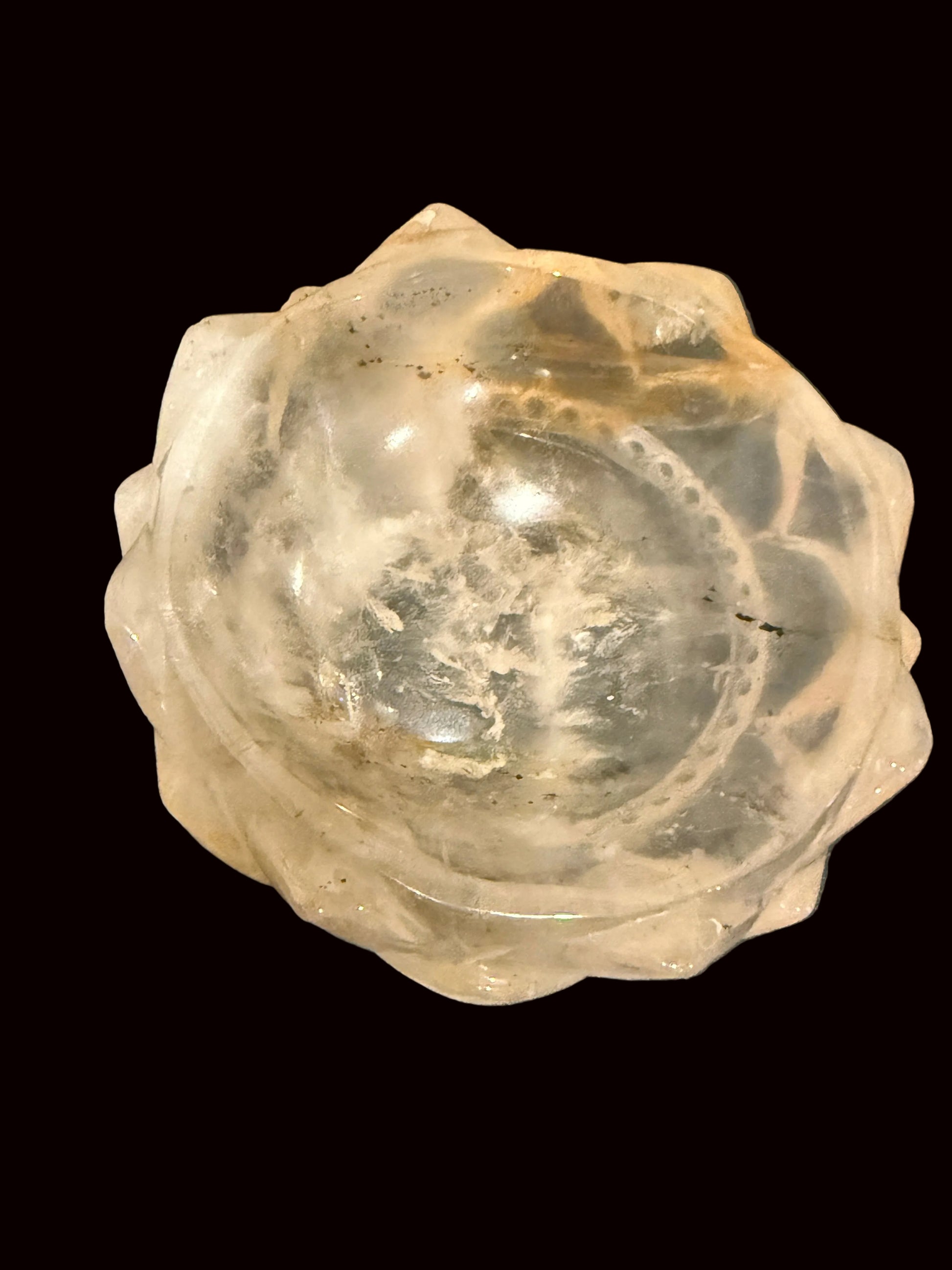 Golden healer crystal lotus bowl - top view on grey surface