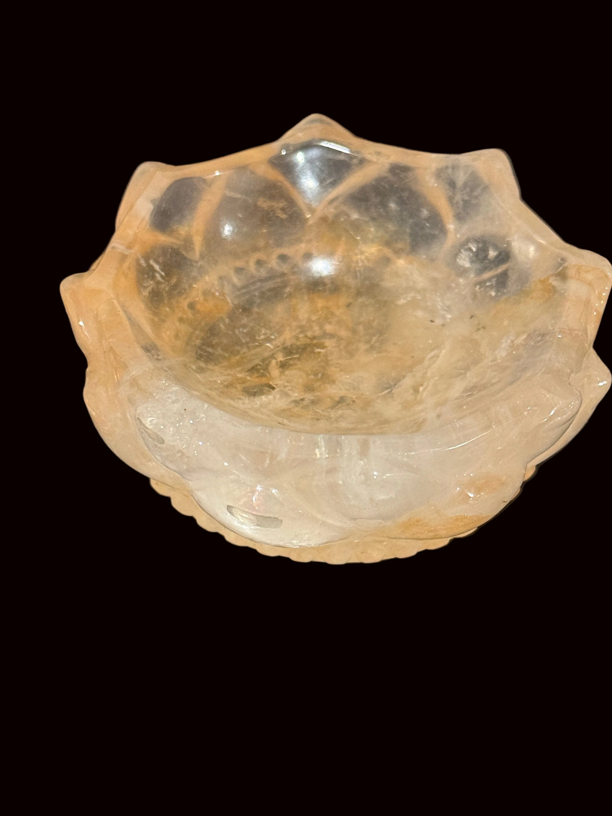 Golden Healer Quartz Lotus Bowl held in hand showing interior view with golden inclusions