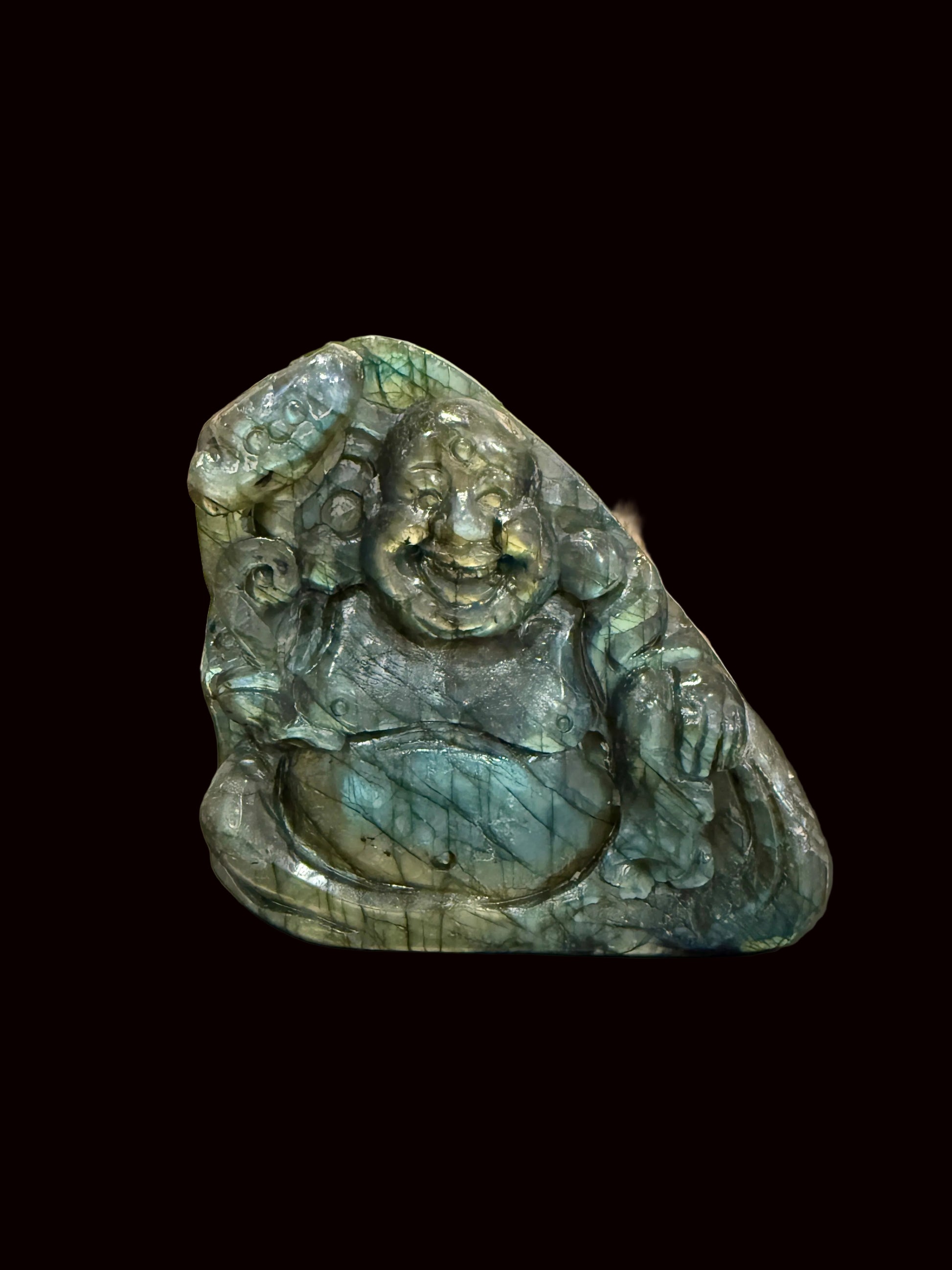Labradorite laughing Buddha carving front view showing blue-green flash