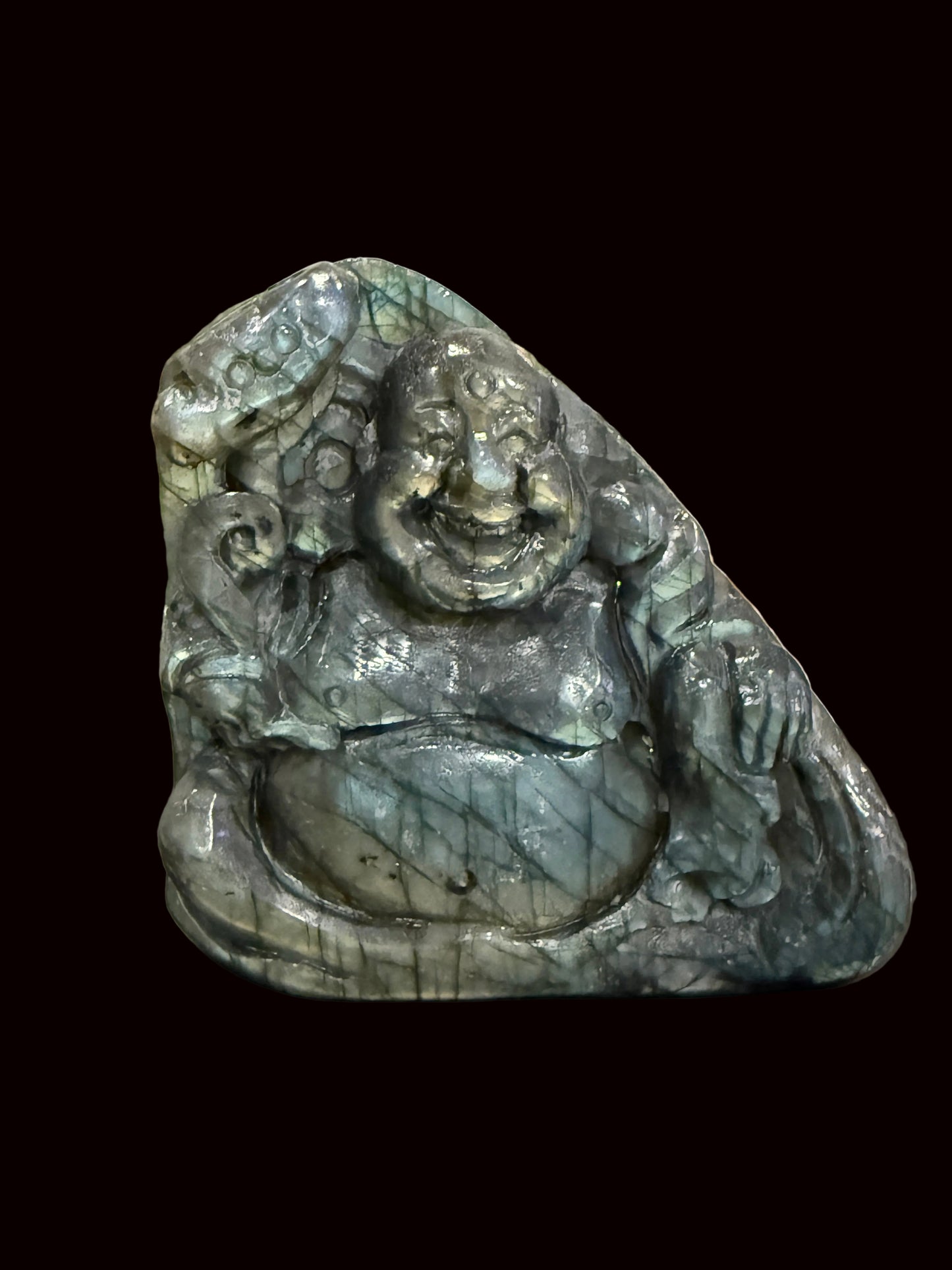 Labradorite Buddha carving side view showing labradorescence