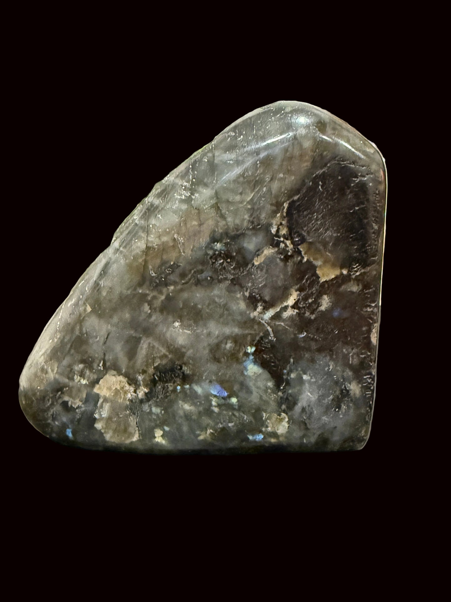 Labradorite Buddha carving back view showing natural raw stone