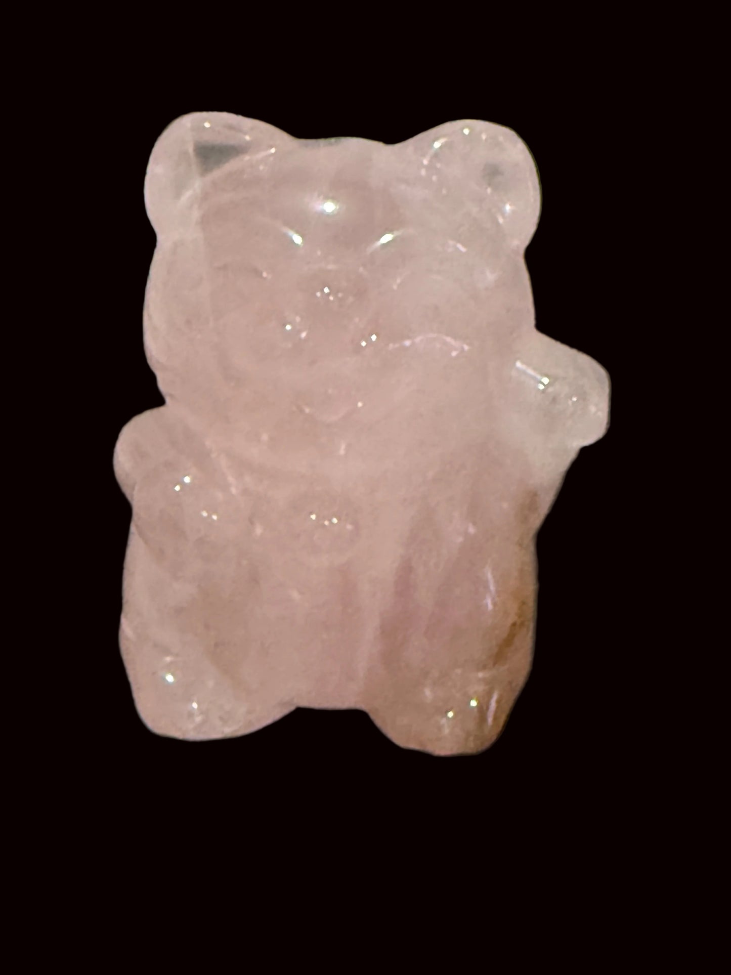 Rose quartz Maneki Neko crystal carving side view showing waving paw