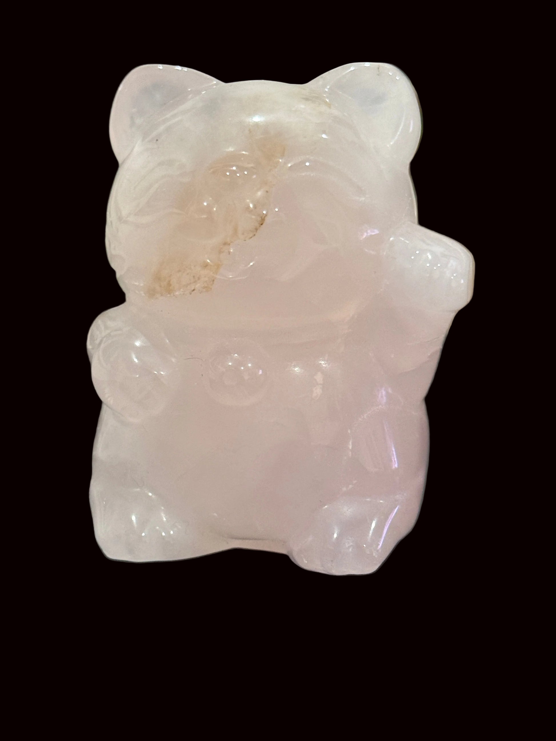 Rose quartz Maneki Neko carving side view showing translucent pink stone