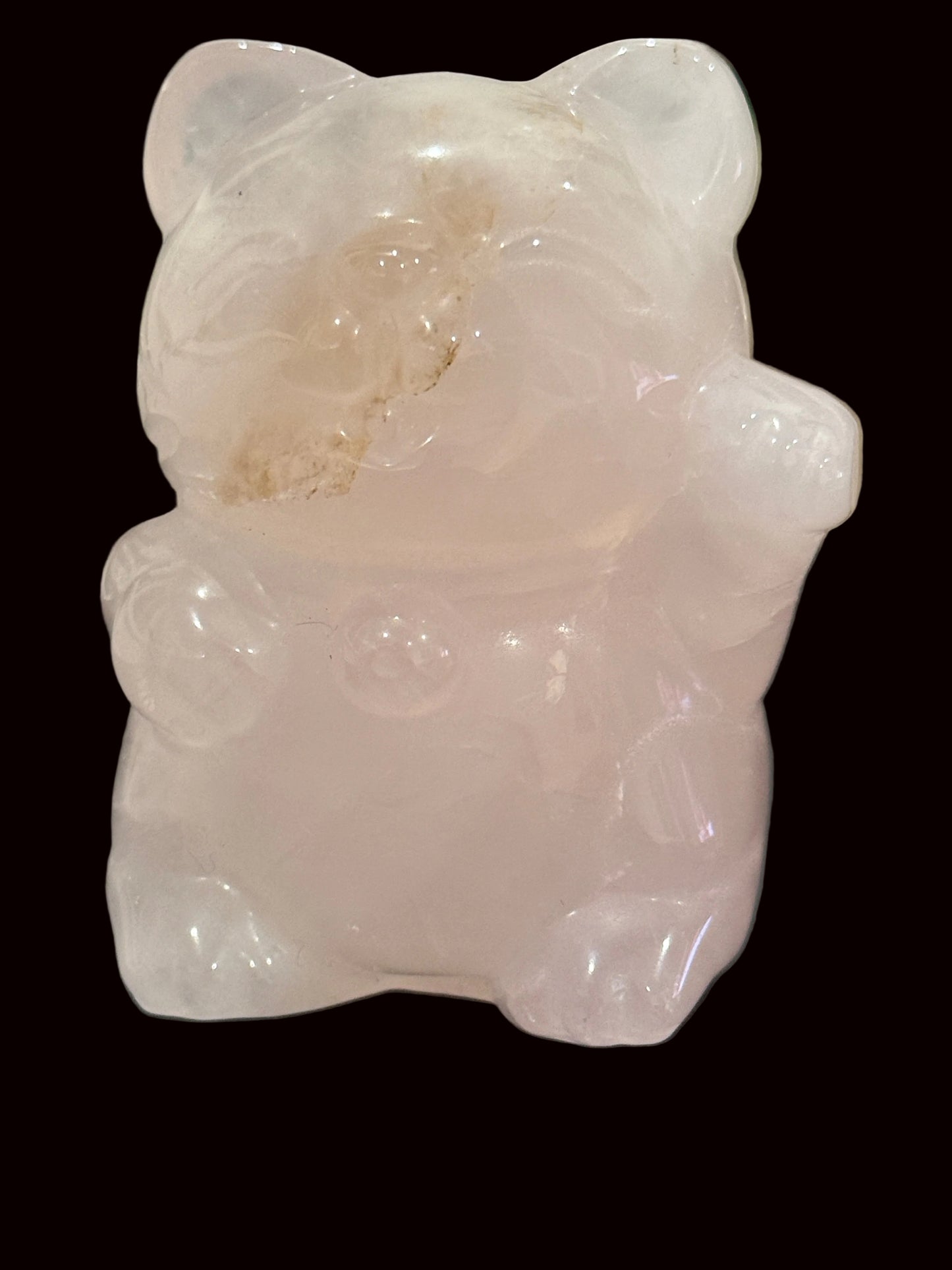 Rose quartz lucky cat carving close-up showing facial details and inclusions