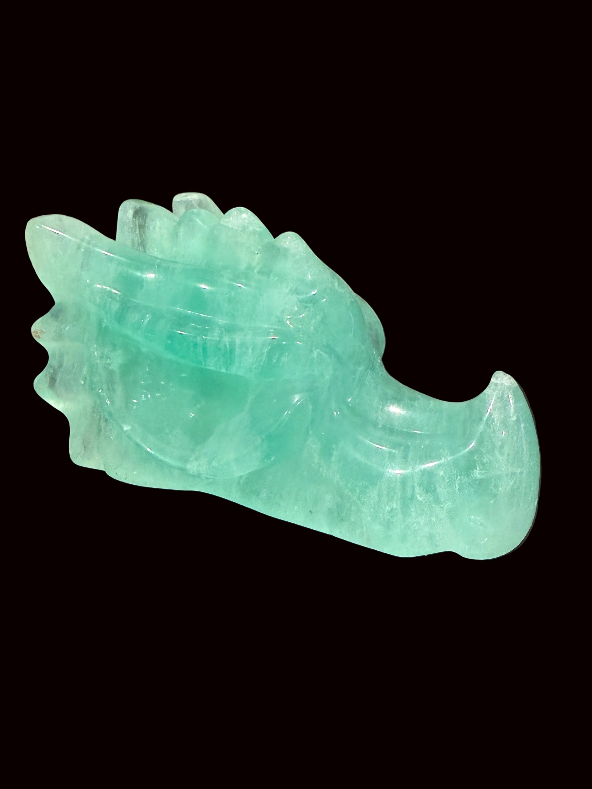 Green fluorite crystal dragon head carving back angle view