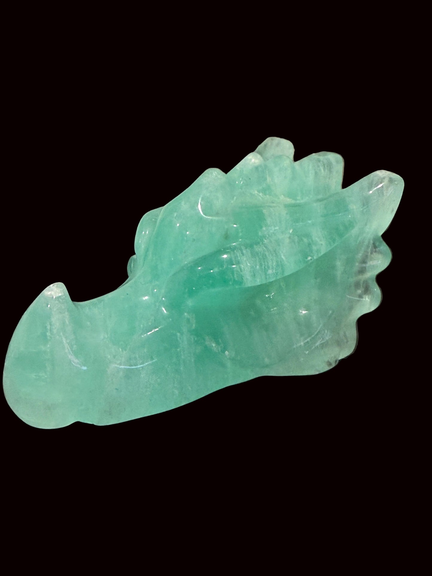 Green fluorite crystal dragon head carving opposite side view
