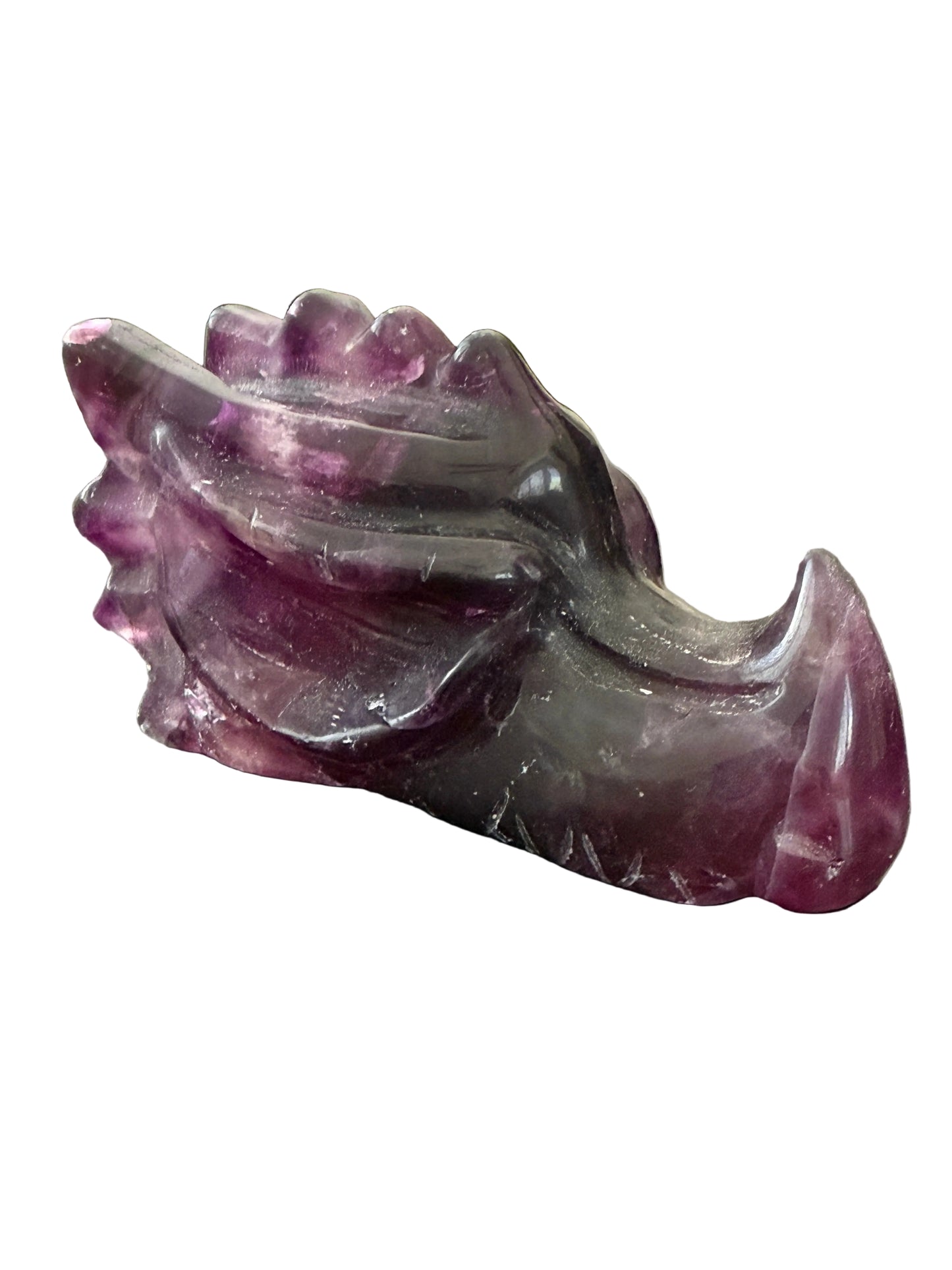 Purple fluorite crystal dragon head carving three-quarter angle view