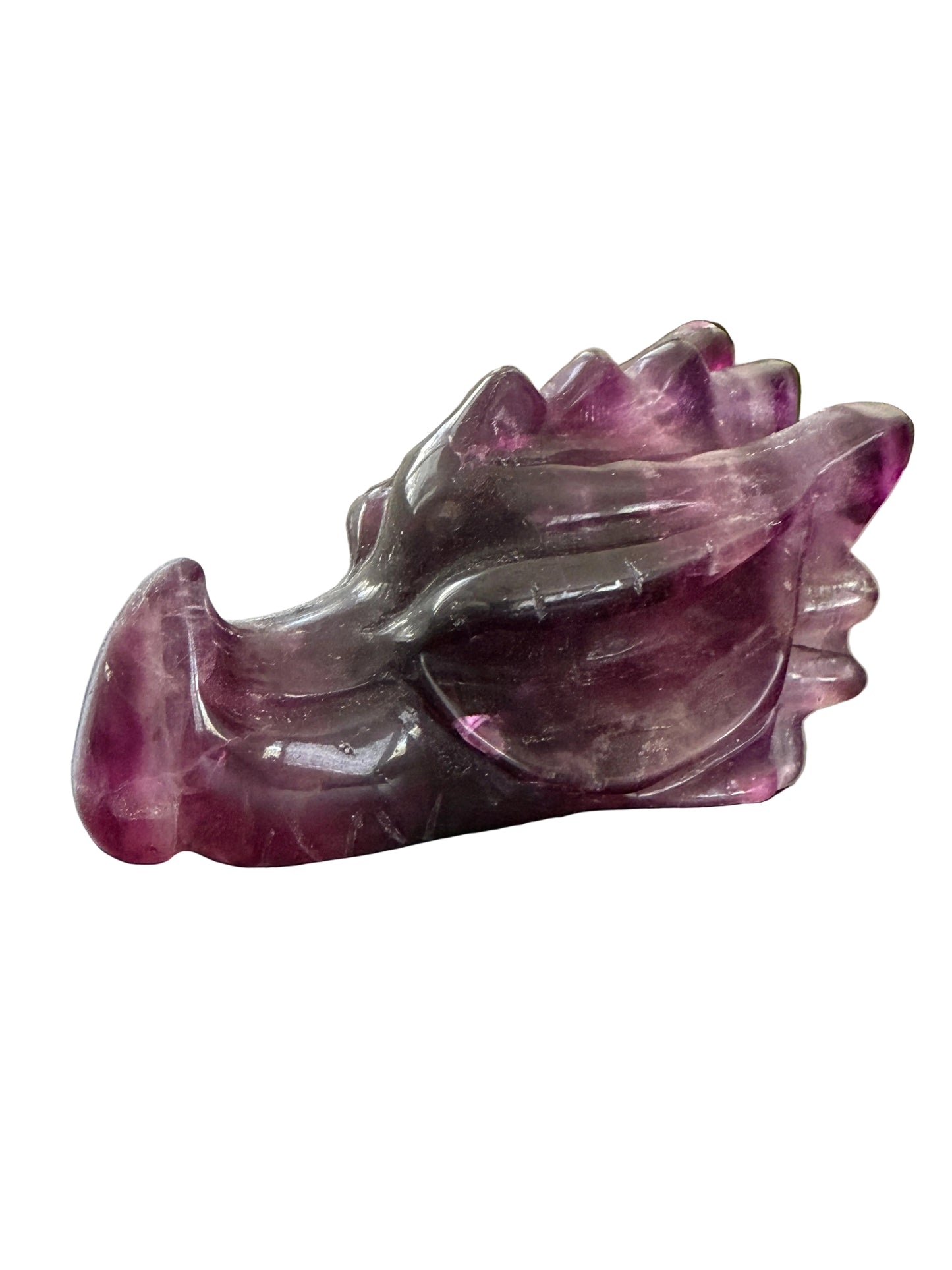 Purple fluorite crystal dragon head carving lifestyle shot showing full piece