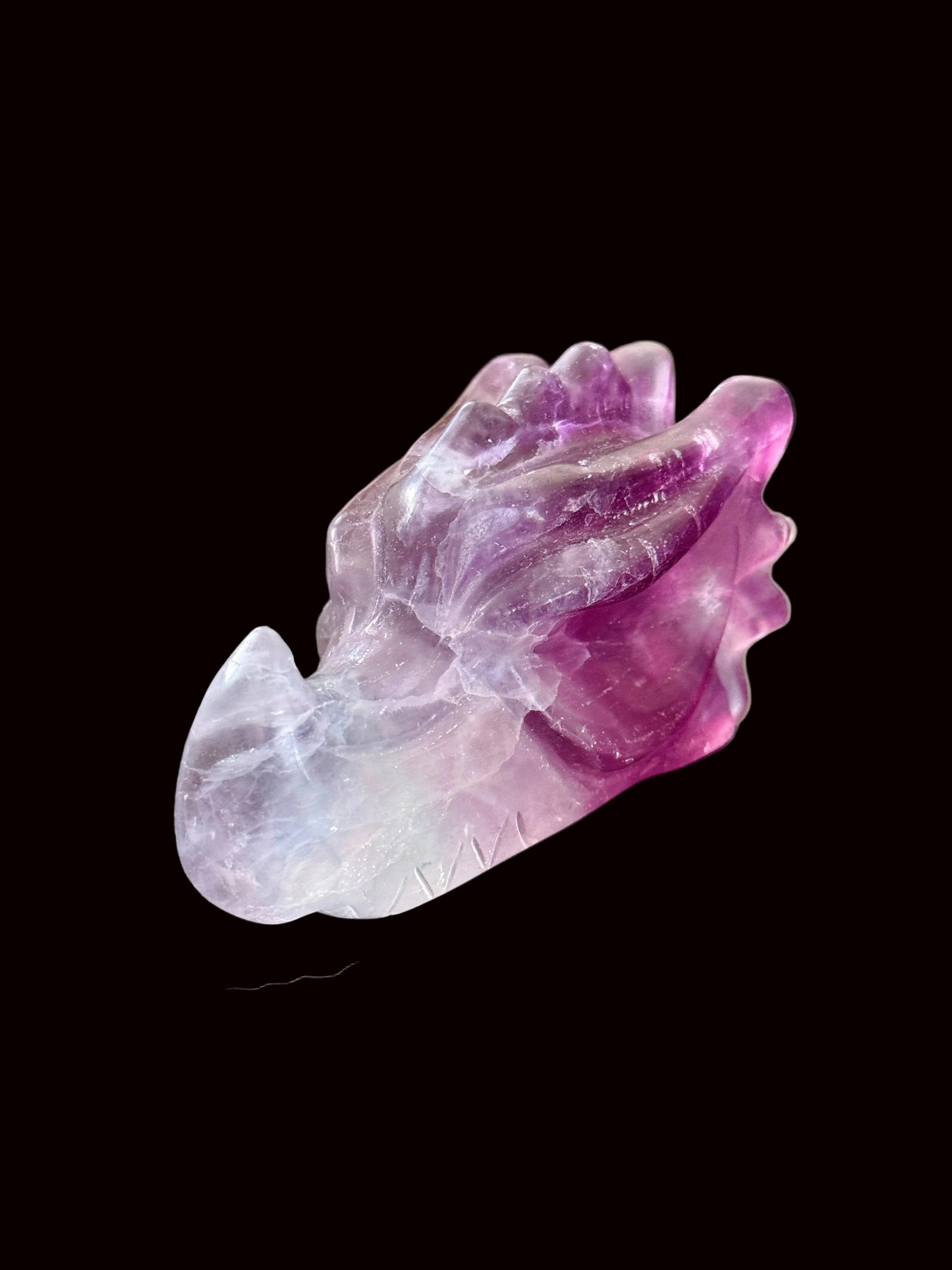 Lavender purple fluorite crystal dragon head carving front three-quarter view
