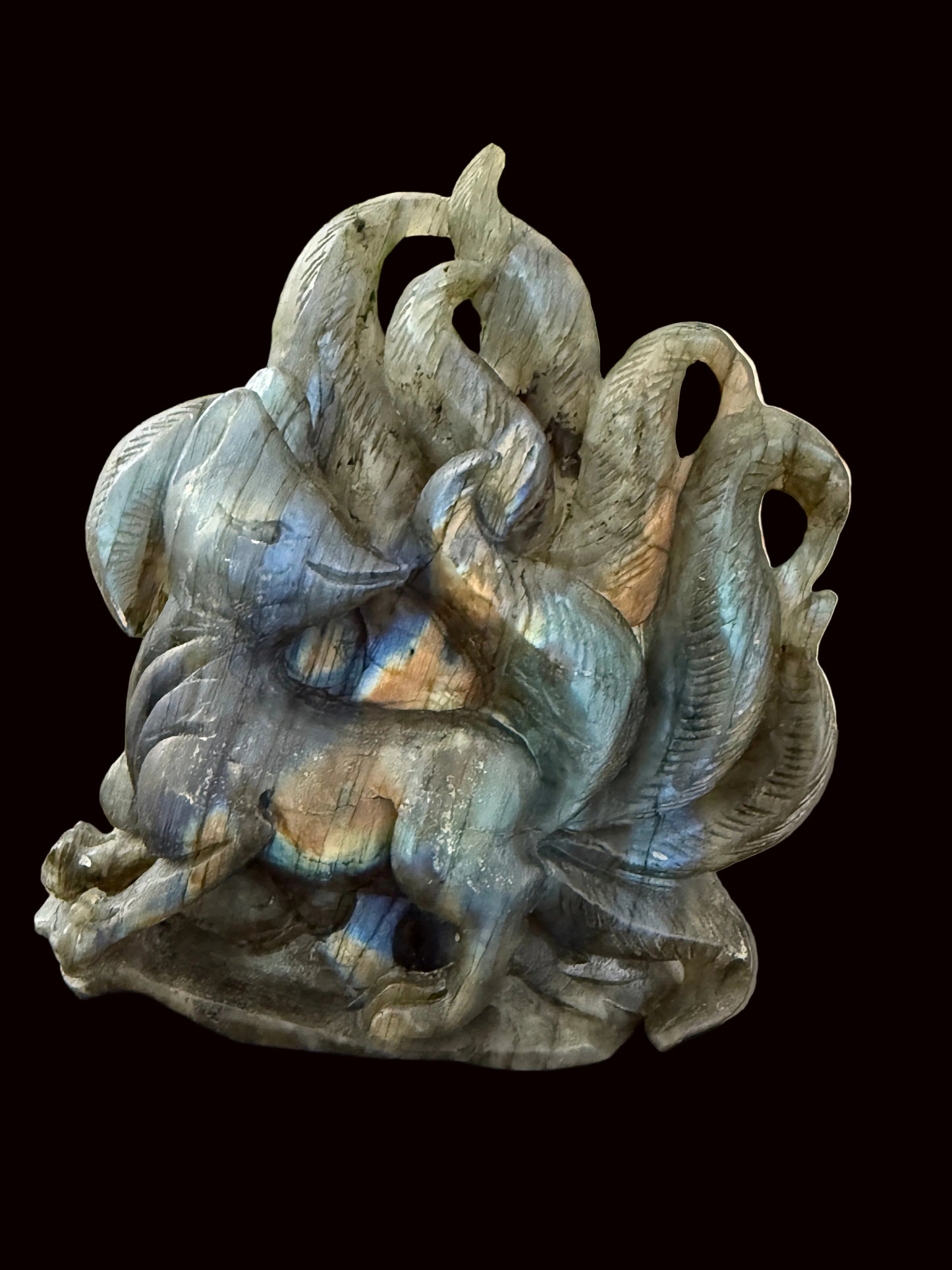 Labradorite nine-tail fox crystal carving lifestyle shot showing scale and flash