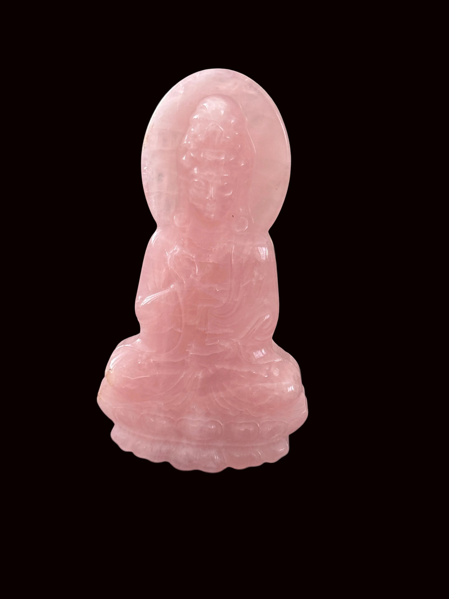 Rose quartz Guan Yin carving close-up showing translucent blush pink stone quality