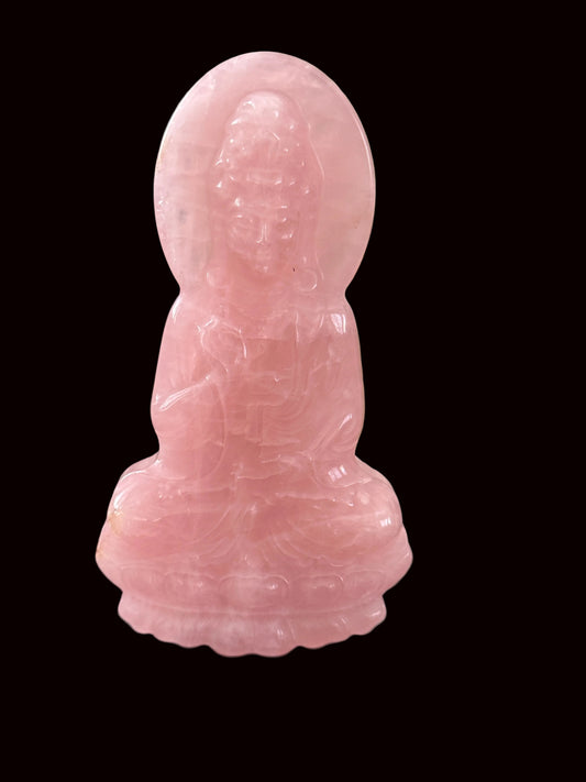Rose quartz Guan Yin crystal carving front view showing serene face and flowing robes