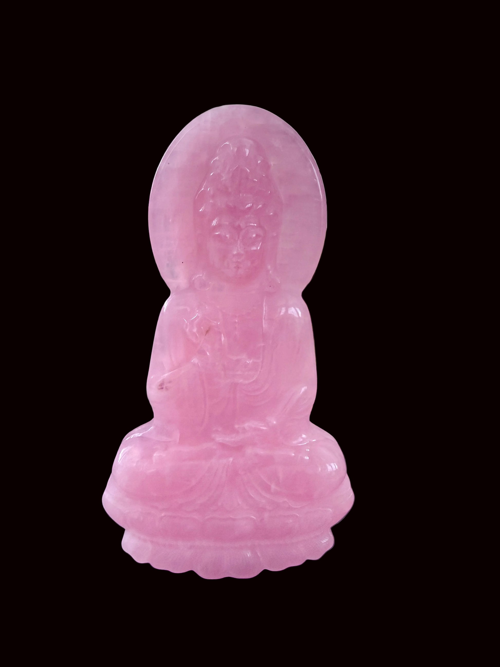 Rose quartz Guan Yin carving three-quarter view showing full height and halo
