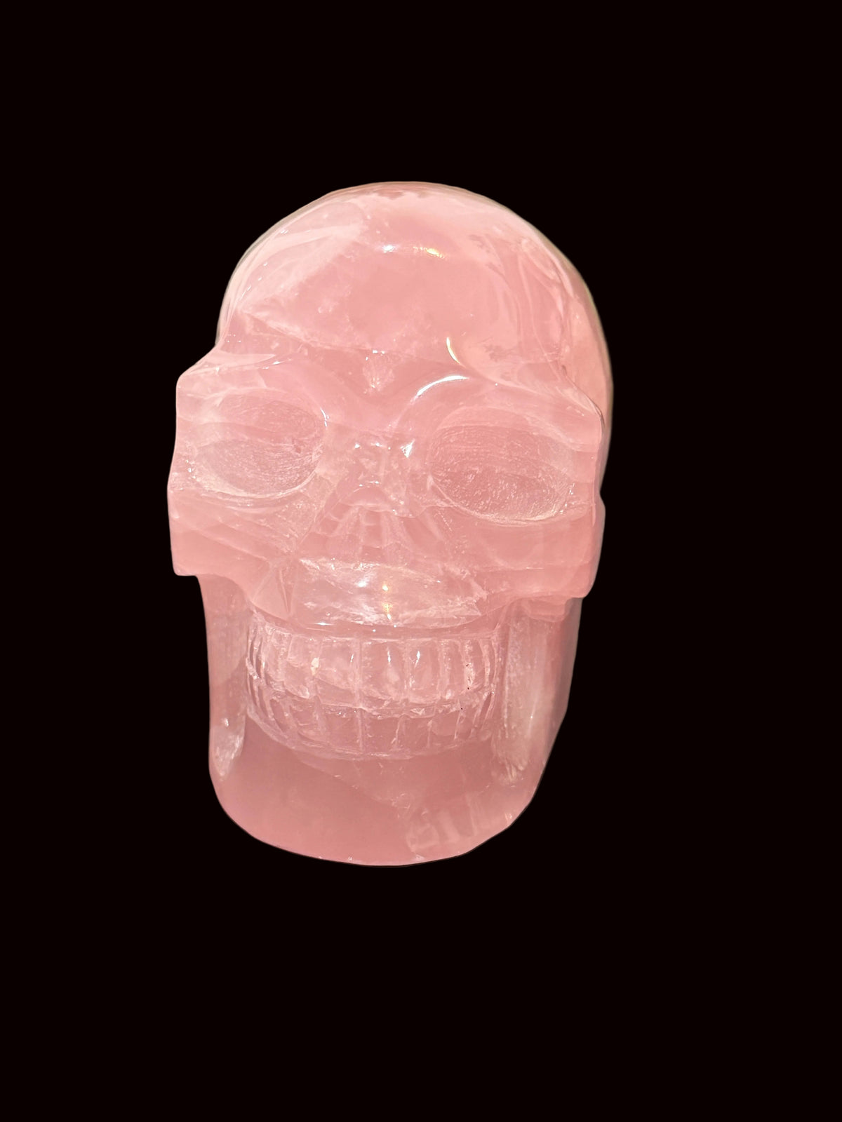 Madagascar Rose Quartz Crystal Skull - left profile view showing polish
