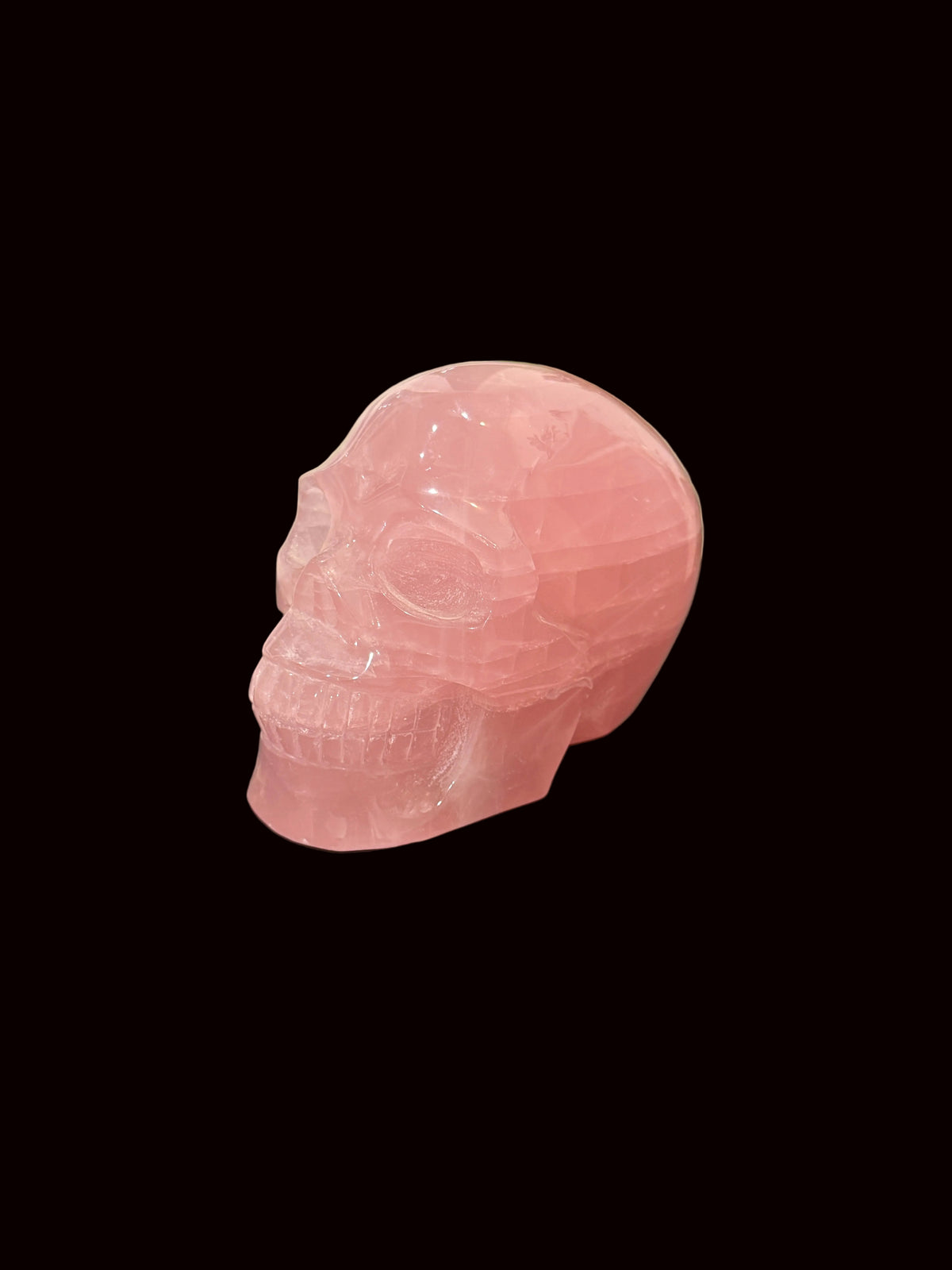 Madagascar Rose Quartz Crystal Skull - front face view showing eye socket detail