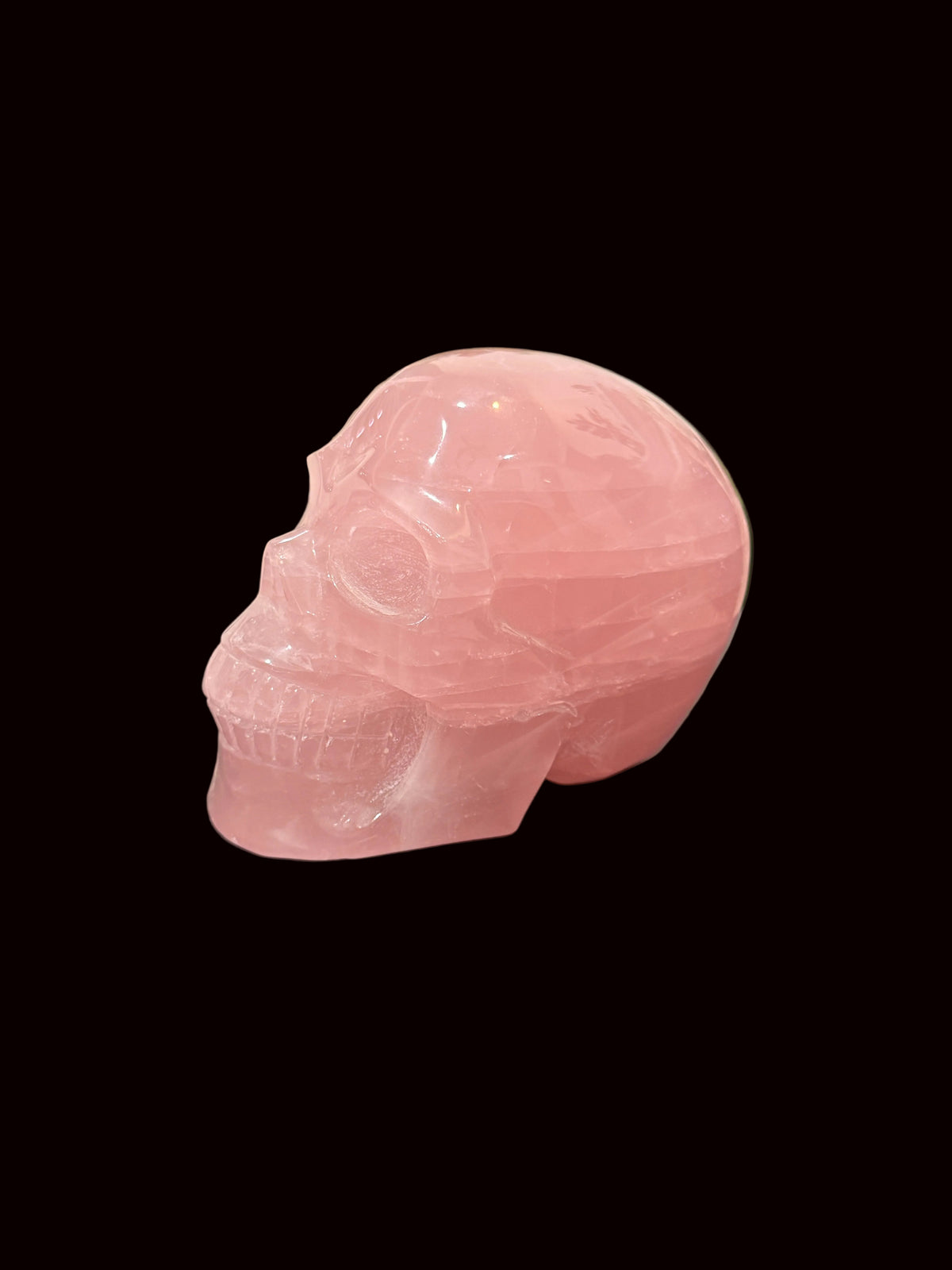 Madagascar Rose Quartz Crystal Skull - front angled view showing detailed carving