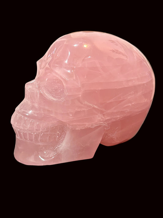 Large Madagascar Rose Quartz Crystal Skull - side view showing soft pink translucency