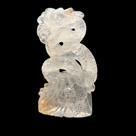 Clear quartz dragon carving - white background side