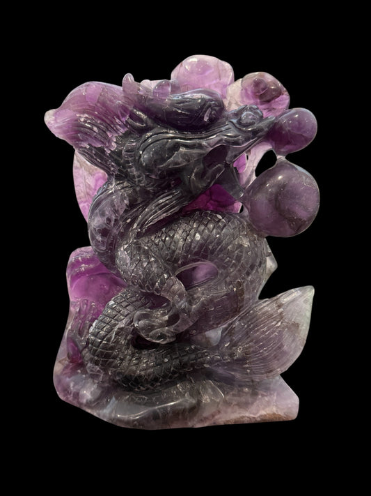 Purple fluorite dragon carving - black background front view