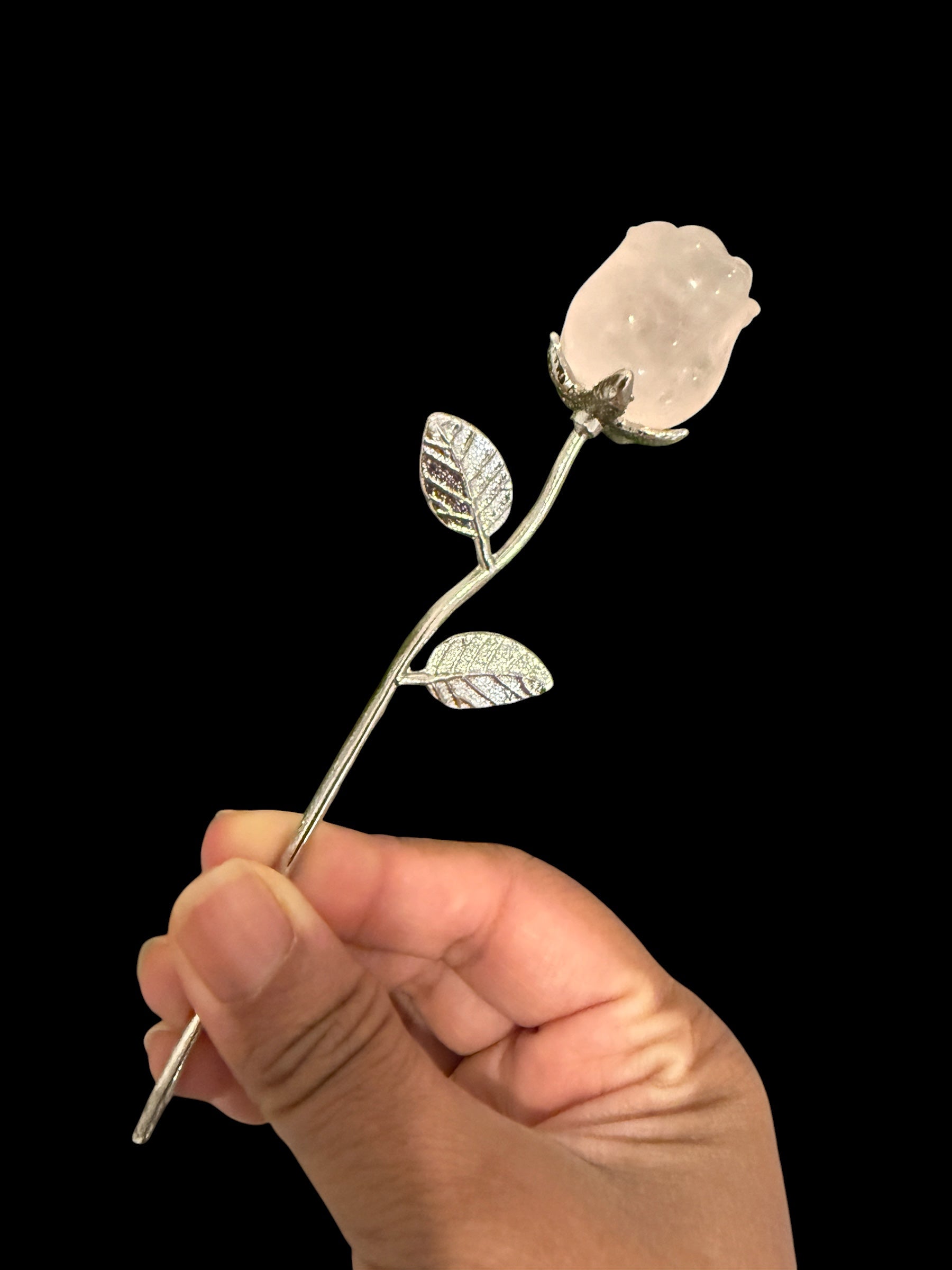 Natural rose quartz crystal rose on silver stem held in hand - 6 inches long