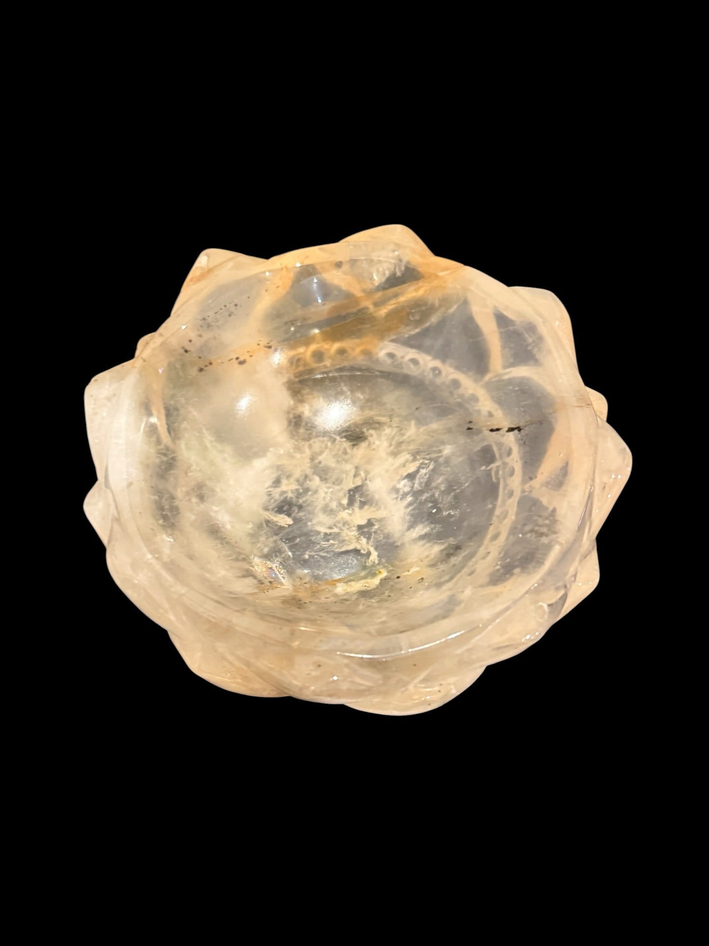 Golden healer crystal lotus bowl - top view on black background