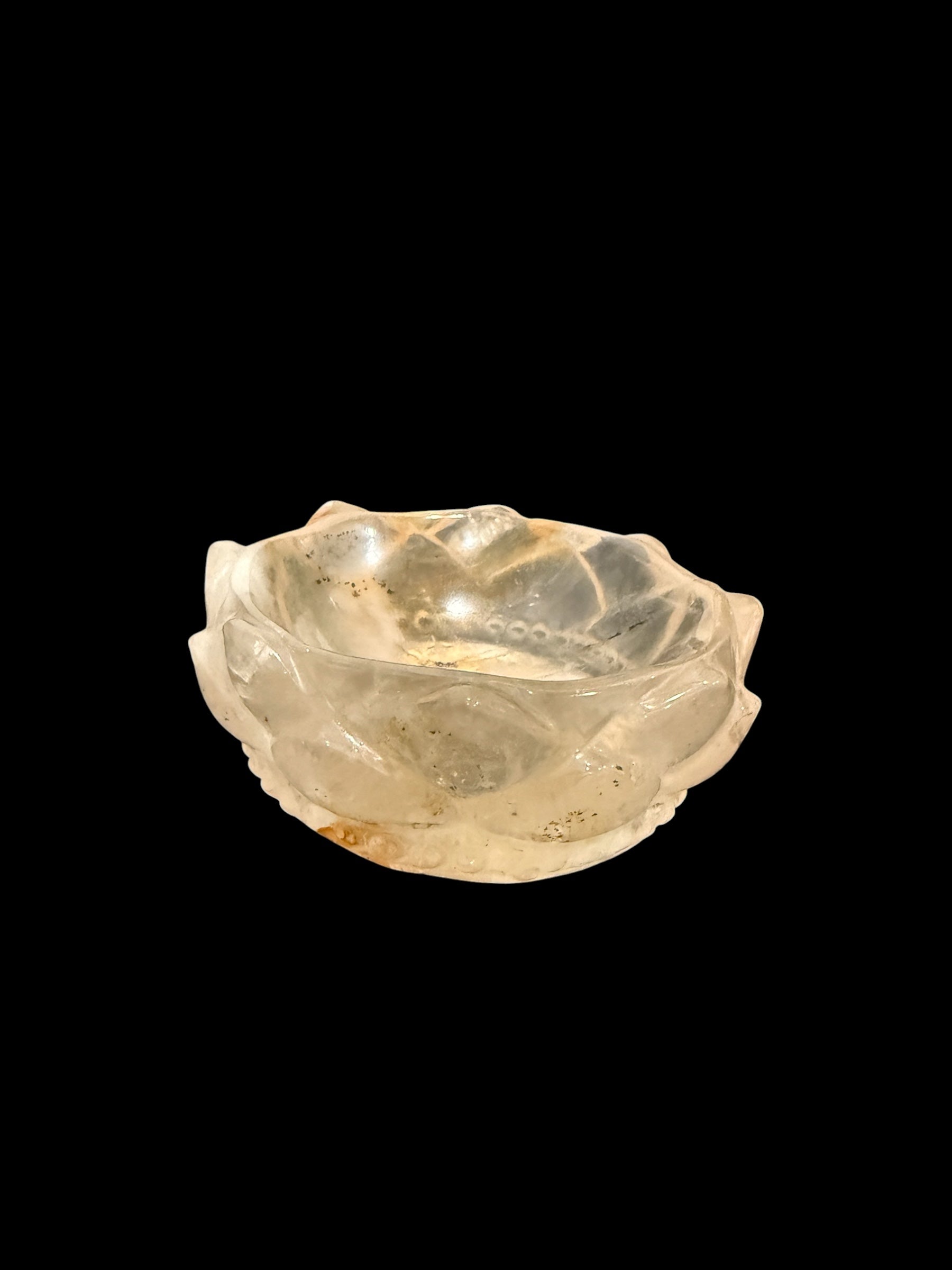 Golden healer crystal lotus bowl - angled side view on black background