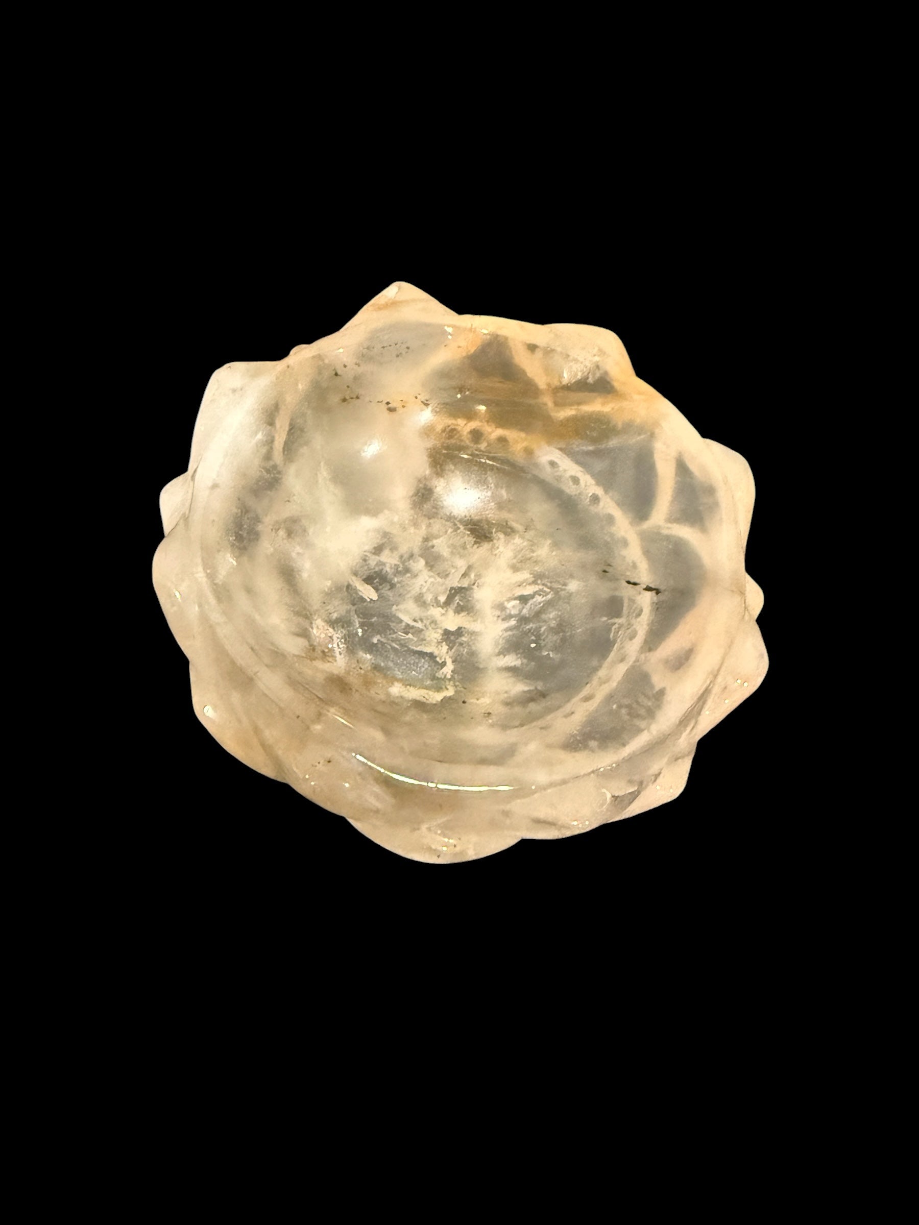 Golden healer crystal lotus bowl - top view showing petal detail on black background