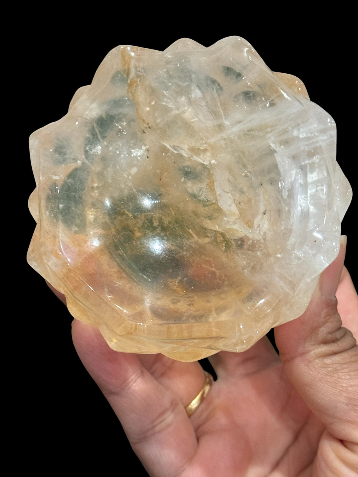 Golden Healer Quartz Lotus Bowl on grey surface showing lotus carving detail