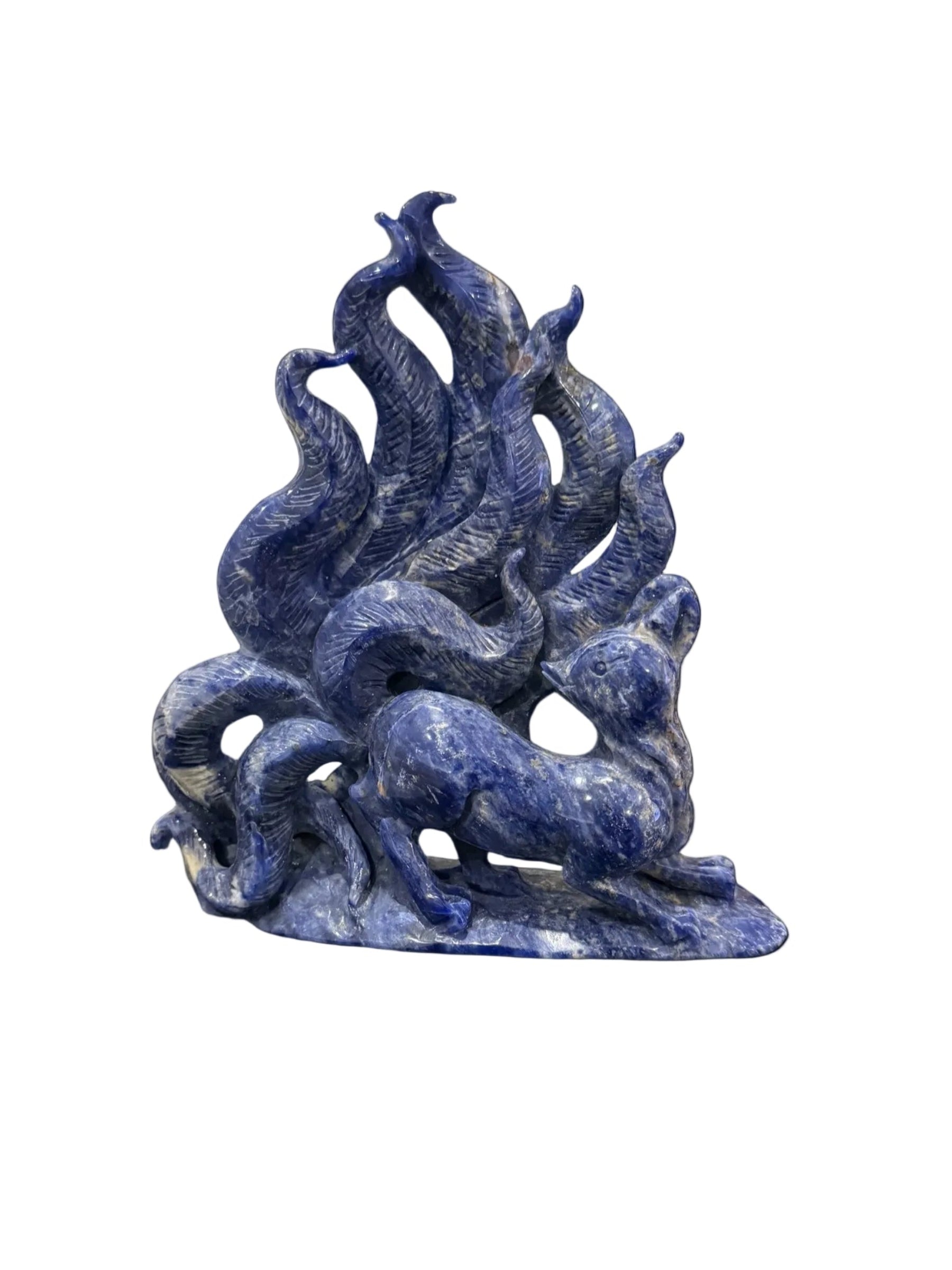 Sodalite nine-tail fox crystal carving front view showing flowing tails and fox figure in deep blue