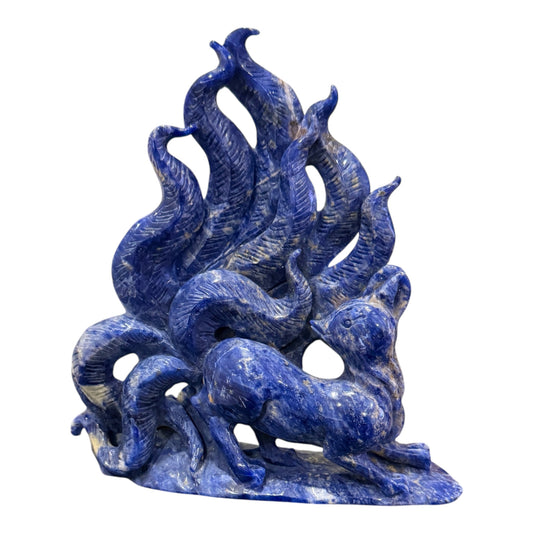 Sodalite nine-tail fox carving back view showing natural stone texture and white calcite veining