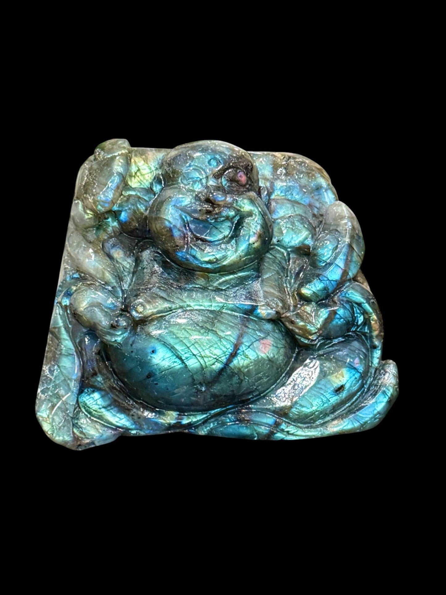 Hand-carved labradorite Buddha carving showing blue-green flash, top view, 612g