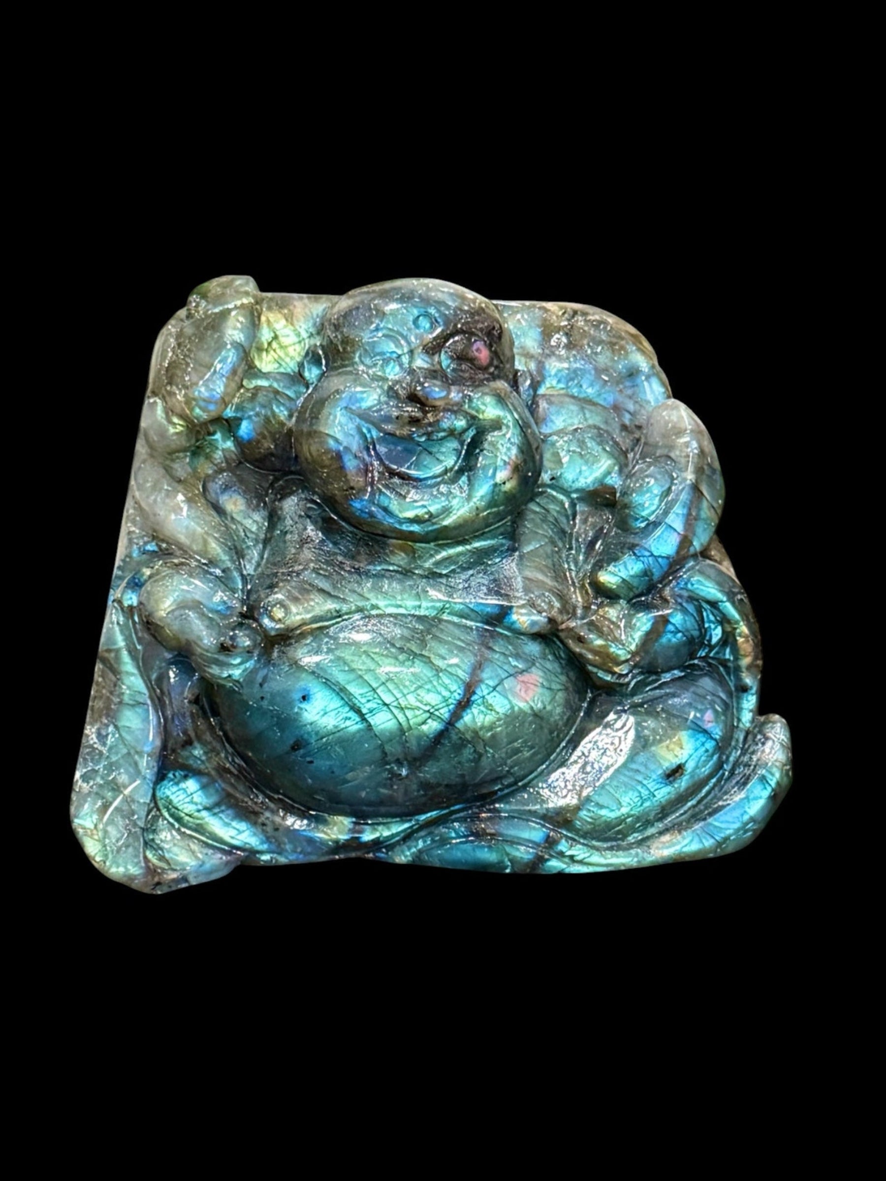 Hand-carved labradorite Buddha carving showing blue-green flash, top view, 612g
